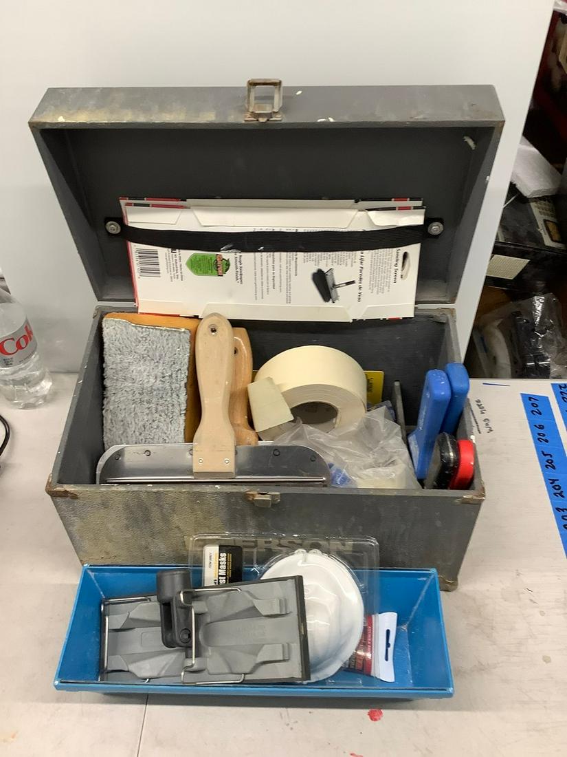 Box full of painting and spackling supplies: Box full of painting and spackling supplies