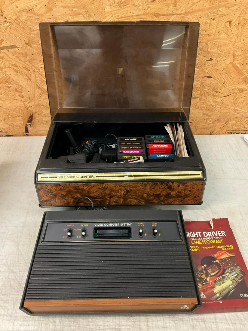 Atari game system and games, and case (1 of 1)