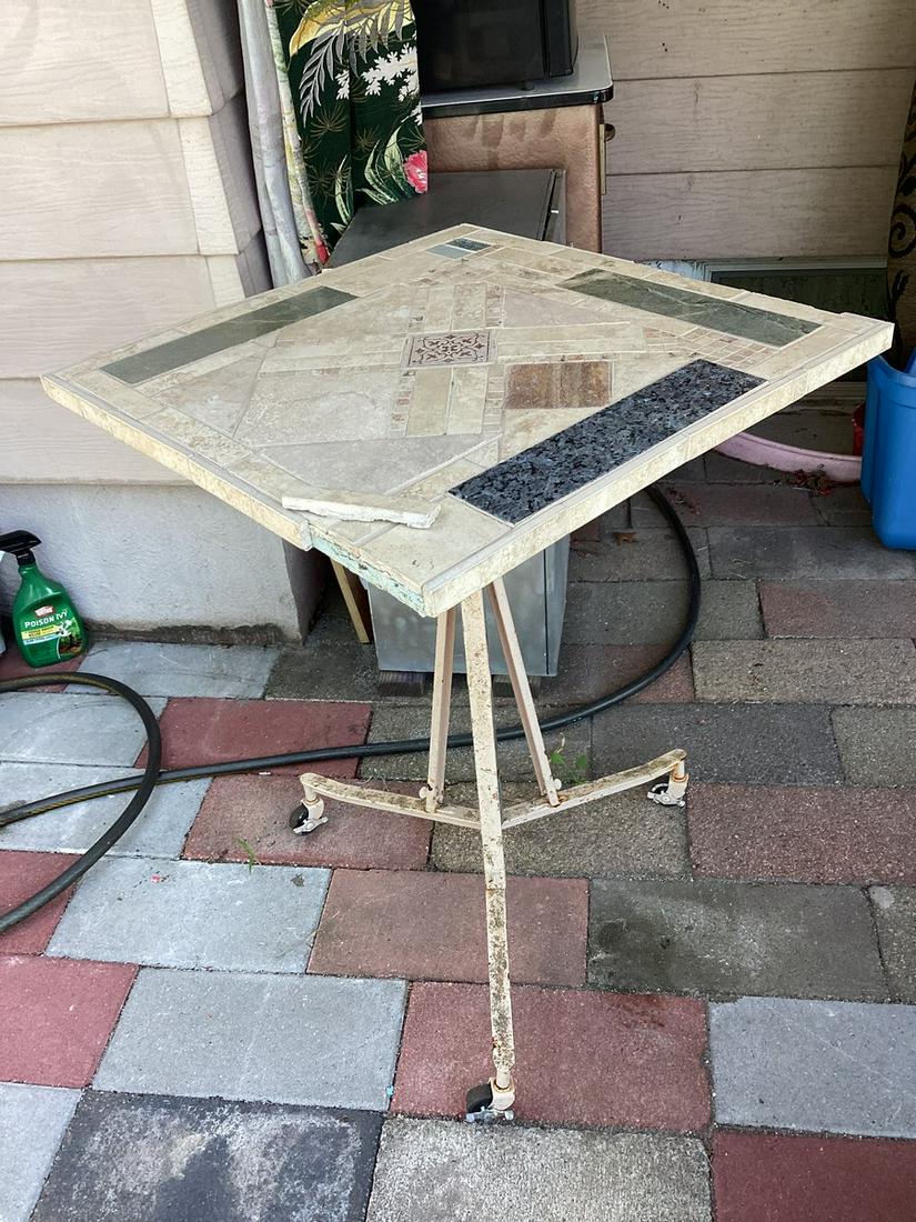 Tile Top Table Metal Base that Spins on Wheels 25"x 25.25"x"x34.5" Needs Some Tile Repair comes with: Tile Top Table Metal Base that Spins on Wheels 25"x 25.25"x"x34.5" Needs Some Tile Repair comes with tile for repair