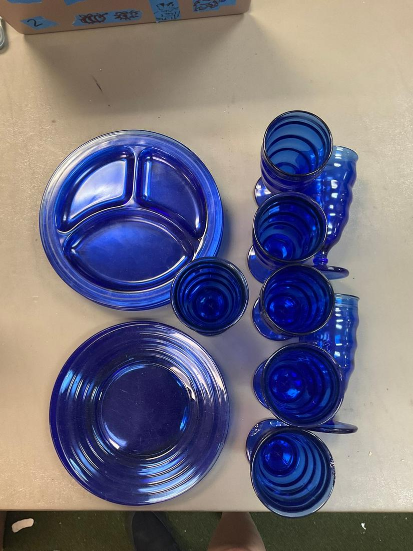 Lot of blue glass plates in various sizes and eight stemmed glasses (1 of 1)