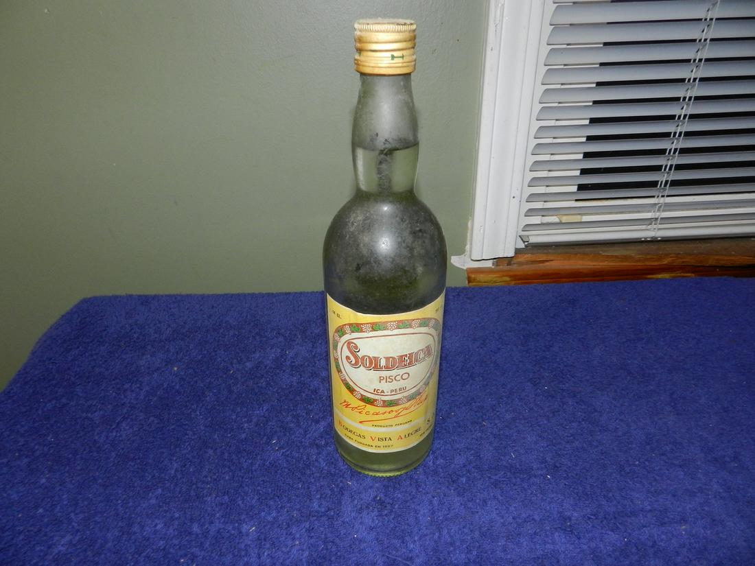 Vintage Bottle Of Soldeica Pisco Made In Peru 750 ml: Any contents in bottle is Free; You are bidding on the bottle & unbroken tax stamp