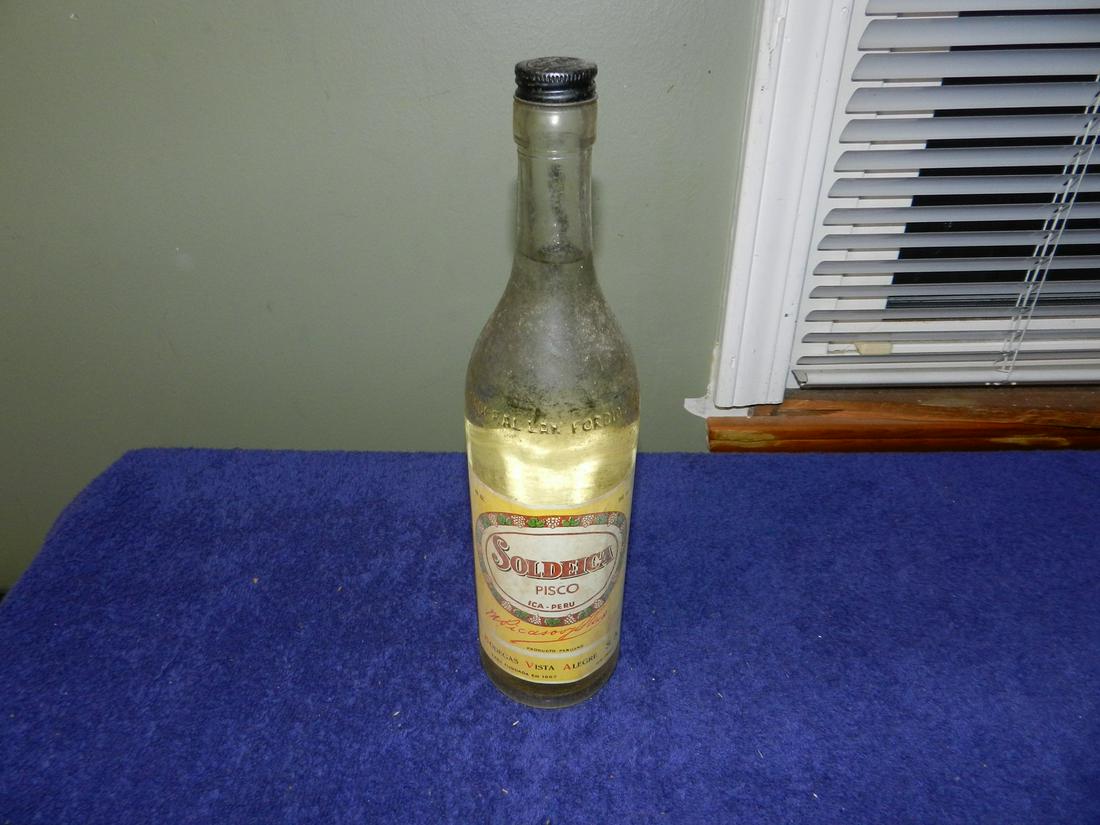 Vintage Bottle Of Soldeica Pisco Made In Peru 750 ml: Any contents in bottle is Free; You are bidding on the bottle & unbroken tax stamp