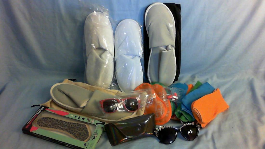Assortment of spa sandles, socks, eye masks, and sun glasses: Assortment of spa sandles, socks, eye masks, and sun glasses