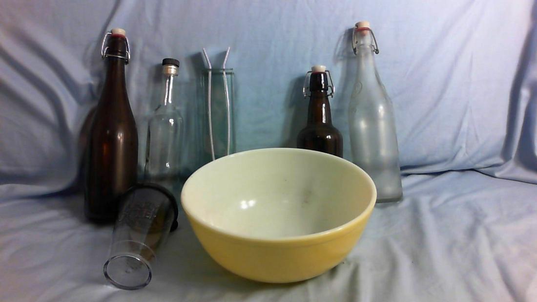 Assorted glass bottles and Pyrex yellow mixing bowl (1 of 1)