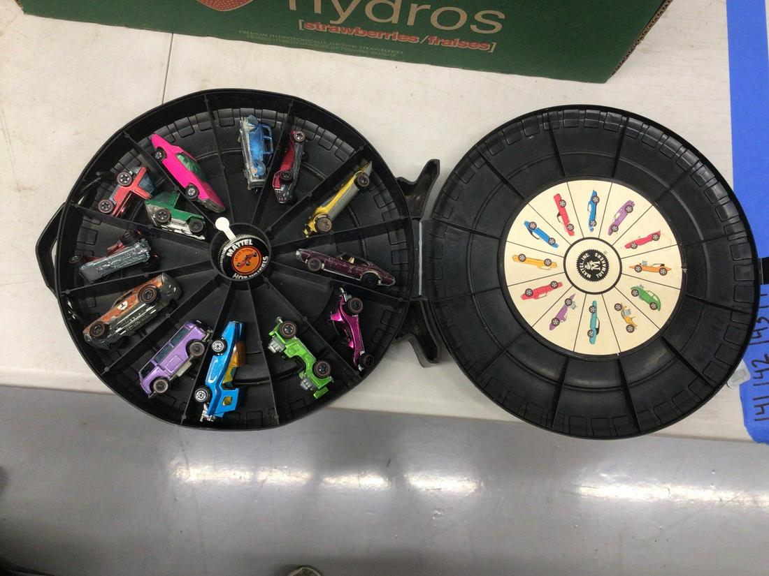 Lot of vintage Hot Wheel cars in round carrier Red Line (1 of 1)