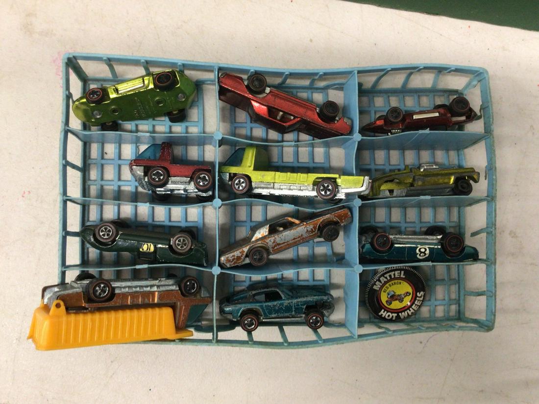 Lot of vintage Hot Wheel cars with red line in blue tray (1 of 1)