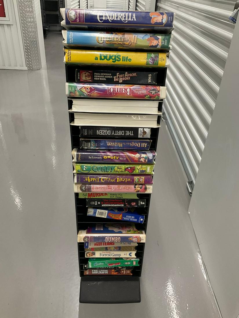 VHS rack full of disney tapes and more: VHS rack full of disney tapes and more