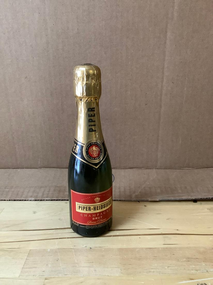 Piper-Heidsieck Champagne Brut 187ml. Sealed: Any contents in bottle is Free; You are bidding on the bottle & unbroken tax stamp