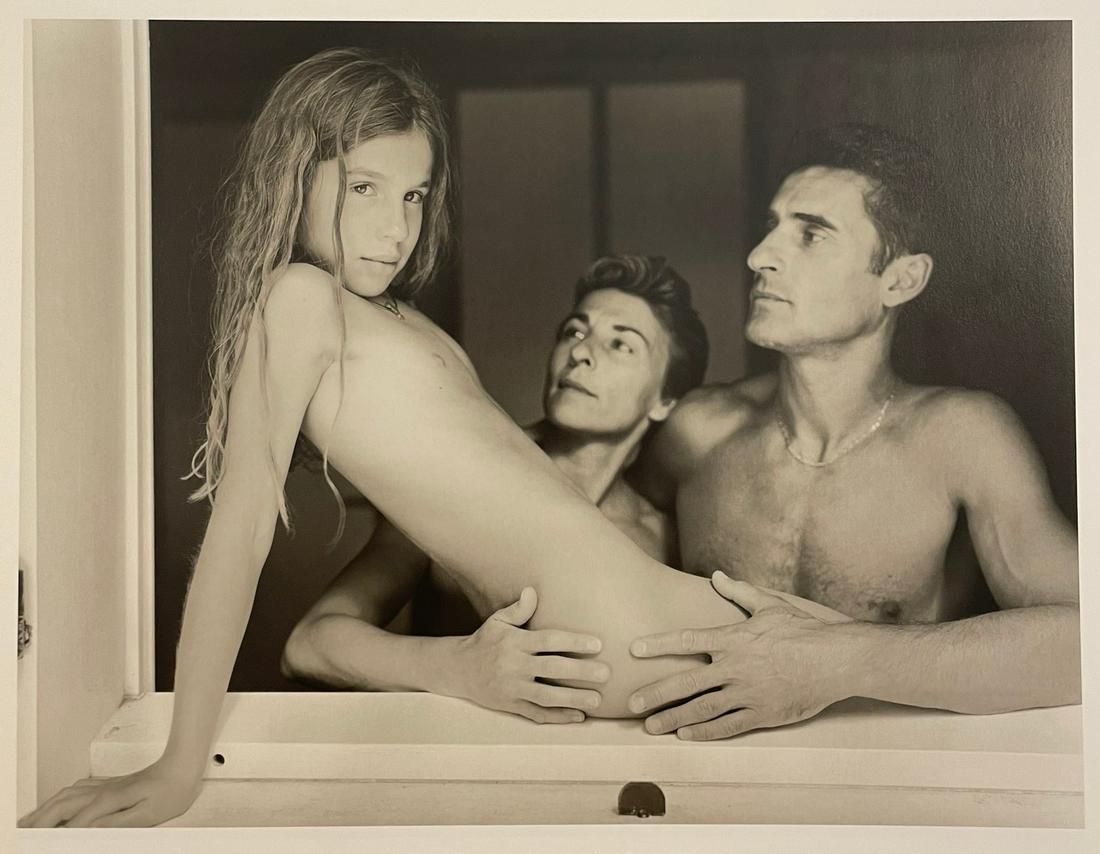 Jock Sturges - Celie, Evelyne and Ludovic, 1999: JOCK STURGES (B. 1947) Celie, Evelyne and Ludovic; Montalivet, France Print in Colors 8 1/2" x 11" Jock Sturges (American, b.1947) is best known for his intimate, arresting photographs, often of nude