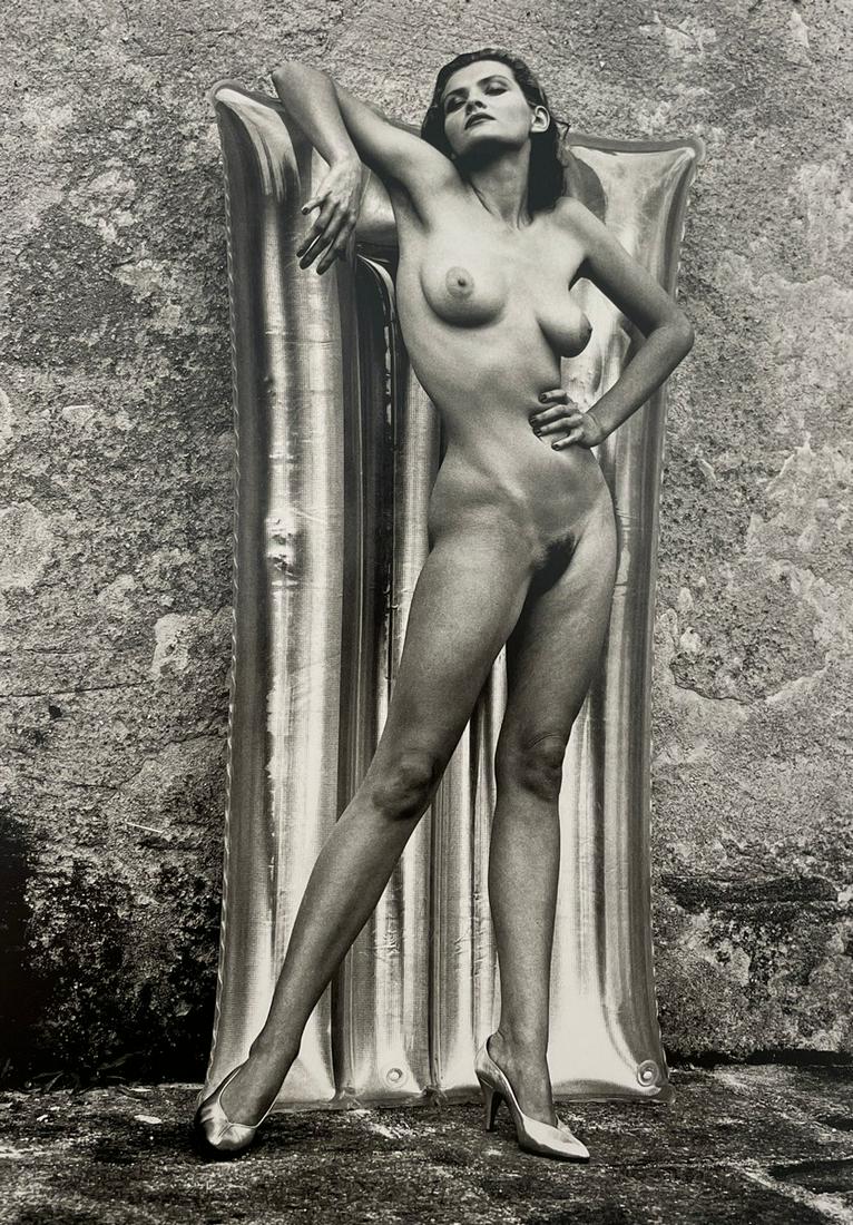 Helmut Newton - Sylvia, 1981: HELMUT NEWTON (1920-2004) Sylvia, Ramatuelle, France, 1981 Print in Colors 9 1/4" x 13 3/4" Helmut Newton was a German high-fashion photographer whose subversive approach to subject matter brought an 
