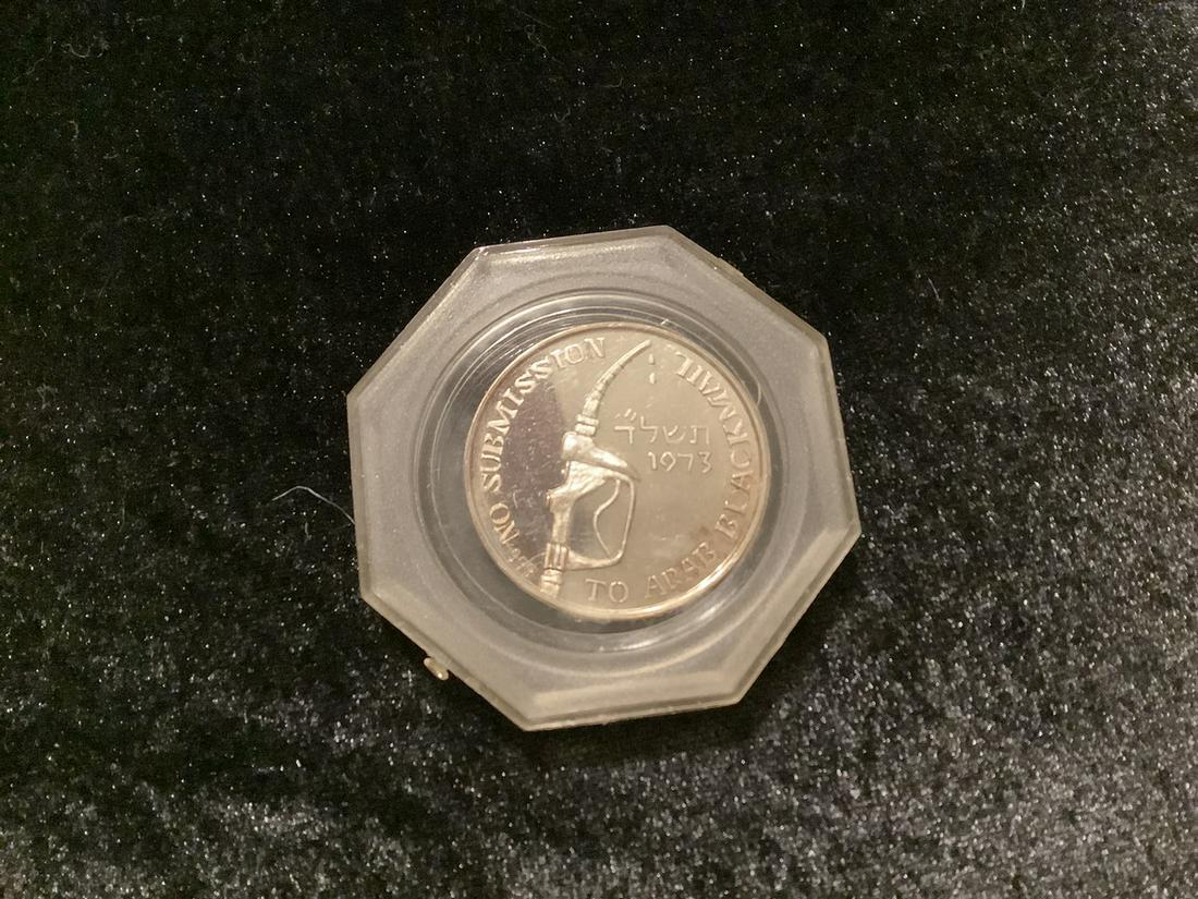 999 silver coin front has tulip with Europe back reads pitcher of gas pump says no submission to (1 of 2)