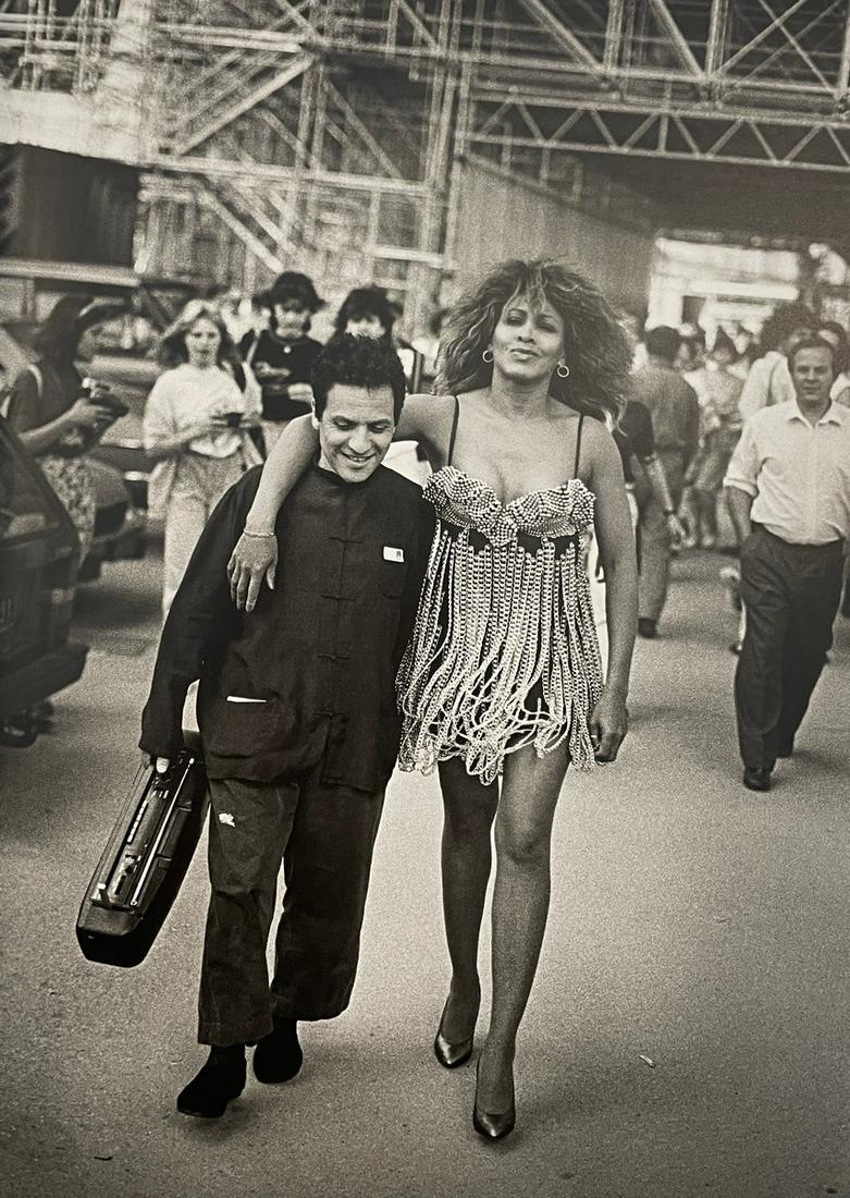 Peter Lindbergh - Azzedine Alaia & Tina Turner, 1989: PETER LINDBERGH (1944-2019) Azzedine Alaia & Tina Turner, Paris, 1989 Print in Colors, Printed in the 2010s 9 1/4" x 13 1/4" Peter Lindbergh was a photographer and video director credited with usherin