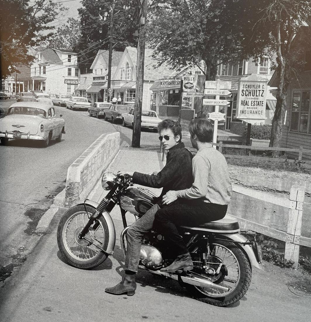 Woodstock - Bob Dylan on his Triumph Tiger 100: WOODSTOCK (1969) Bob Dylan on his Triumph Tiger 100 on the streets of Woodstock Print in Colors 9 1/2" x 9 3/4" The Woodstock Music Festival began on August 15, 1969, as half a million people waited o