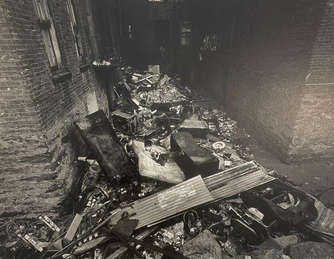 Bruce Davidson - East 100th Street, 1967: BRUCE DAVIDSON (B. 1933) East 100th Street, 1967 Print in Colors 7 3/4" x 9 3/4" Bruce Davidson is an American photographer known for capturing images of communities and individuals living on the frin