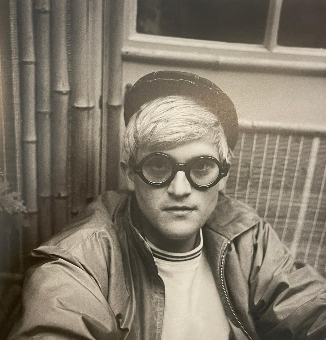 Cecil Beaton - David Hockney, 1965: CECIL BEATON (1904-1980) David Hockney, Reddish, 1965 Print in Colors 10 1/4" x 10 1/2" Cecil Beaton was a British photographer and designer best known for his elegant photographs of high society. Wor