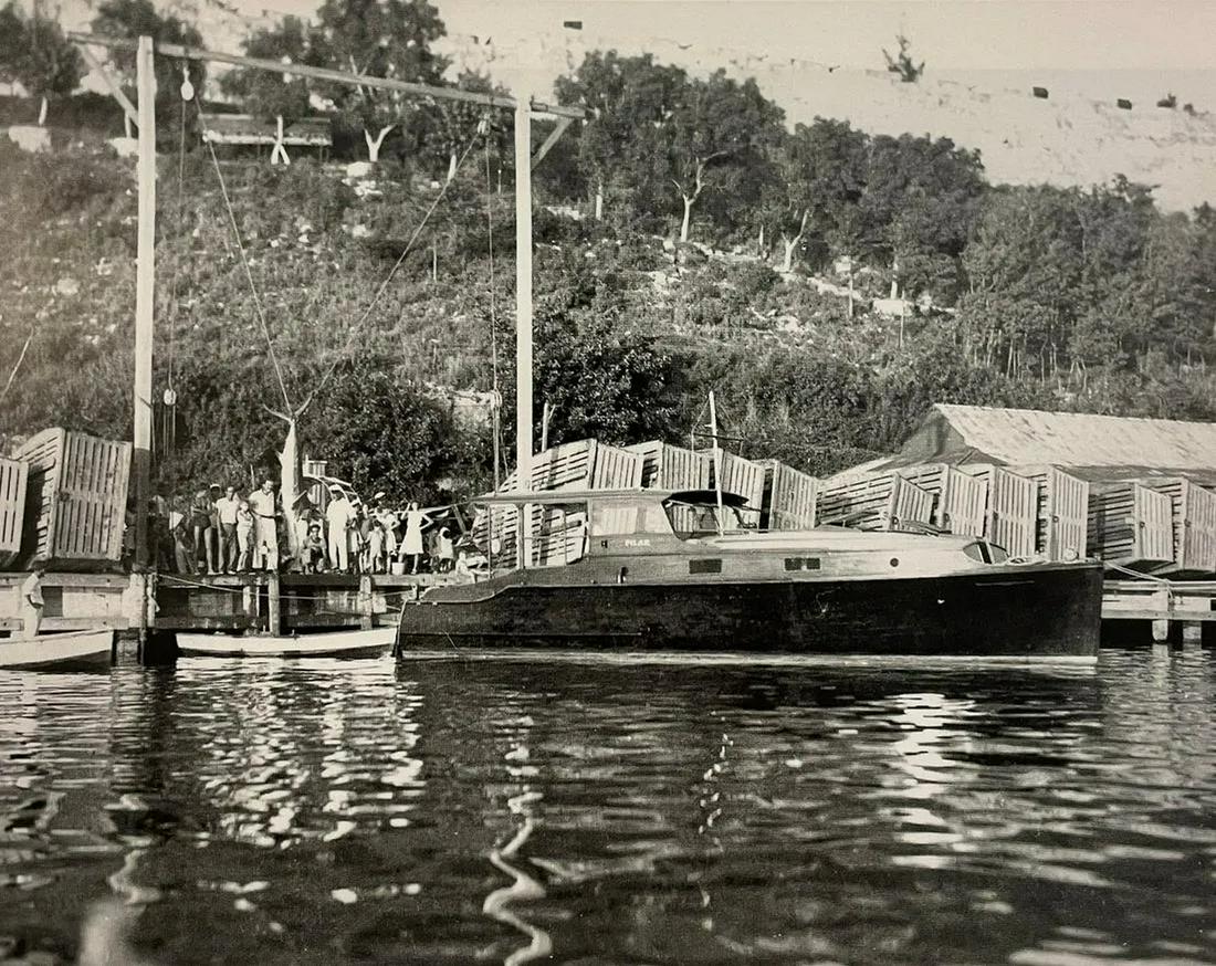 Ernest Hemingway - Ernest Pictured with his Boat and Blue Marlin: ERNEST HEMINGWAY (1899-1961) Hemingway pictured with his boat and a marlin. Print in Colors 6 1/2" x 8" Ernest Hemingway, in full Ernest Miller Hemingway, (born July 21, 1899, Cicero [now in Oak Park]