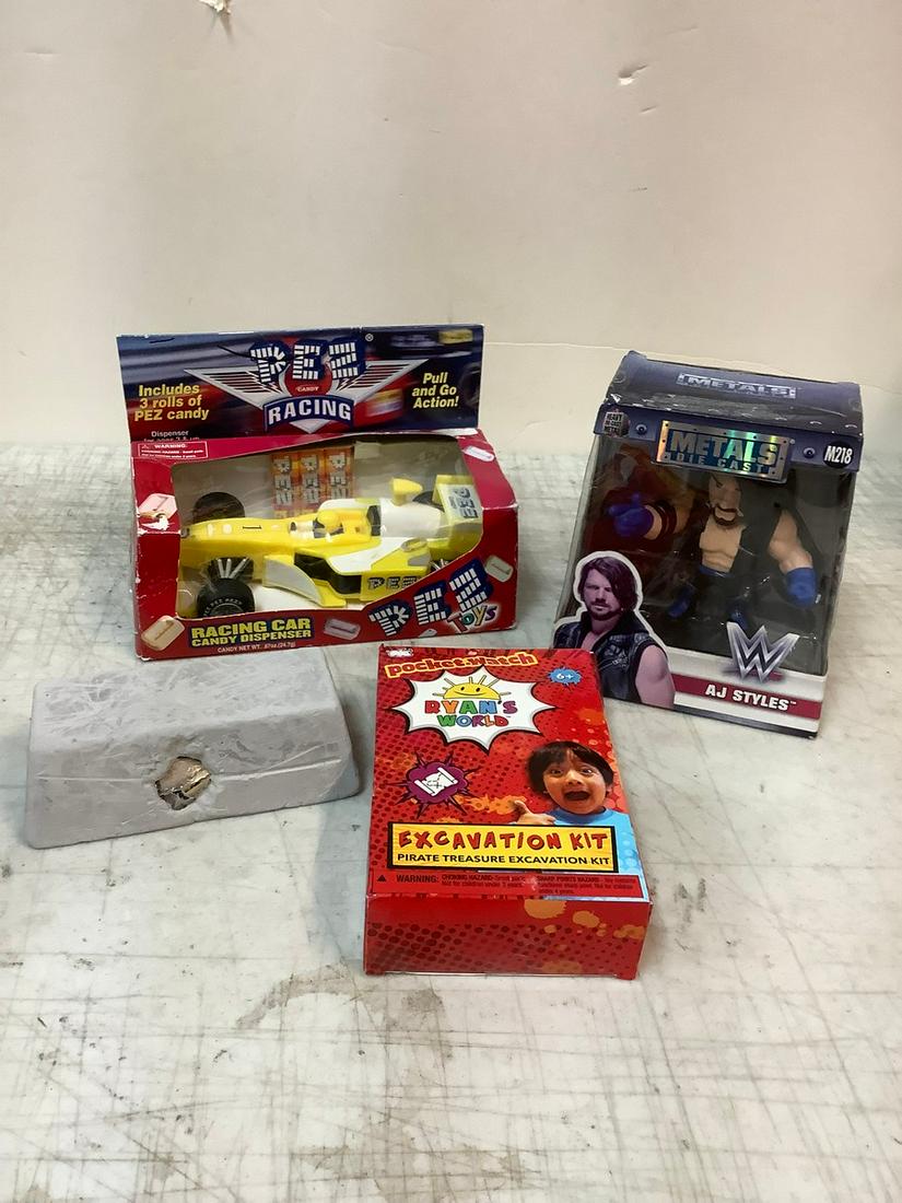 Racing car Pez Dispenser, Ryan Excavation Kit and Die Cast WF Wrestling Figure: Racing car Pez Dispenser, Ryan Excavation Kit and Die Cast WF Wrestling Figure