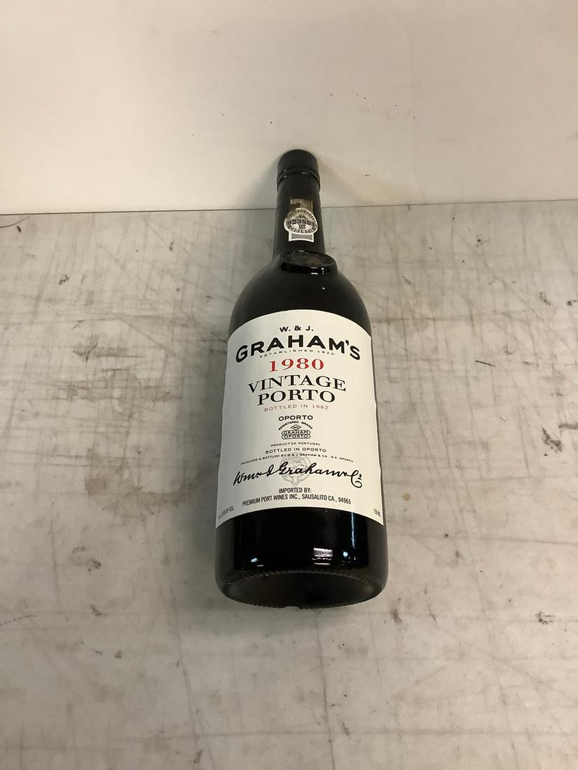 Sealed 1980 W. & J. Graham's Vintage Porto 750ml: Any contents in bottle is Free; You are bidding on the bottle & unbroken tax stamp