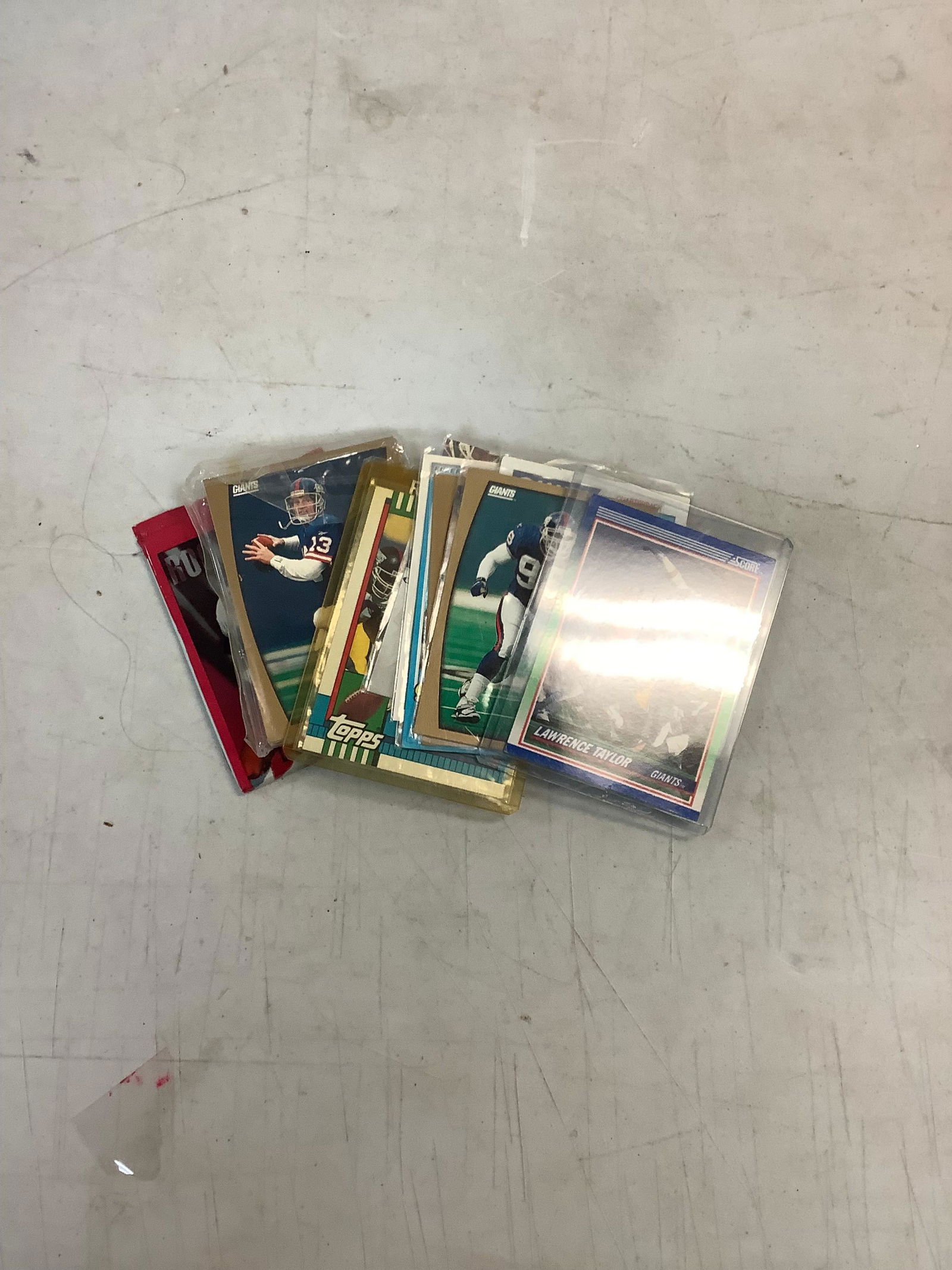 Lot of Football cards including Phil Sims, Lawrence Taylor, Tiki Barber, Skybox Rookie Cards and: Lot of Football cards including Phil Sims, Lawrence Taylor, Tiki Barber, Skybox Rookie Cards and more