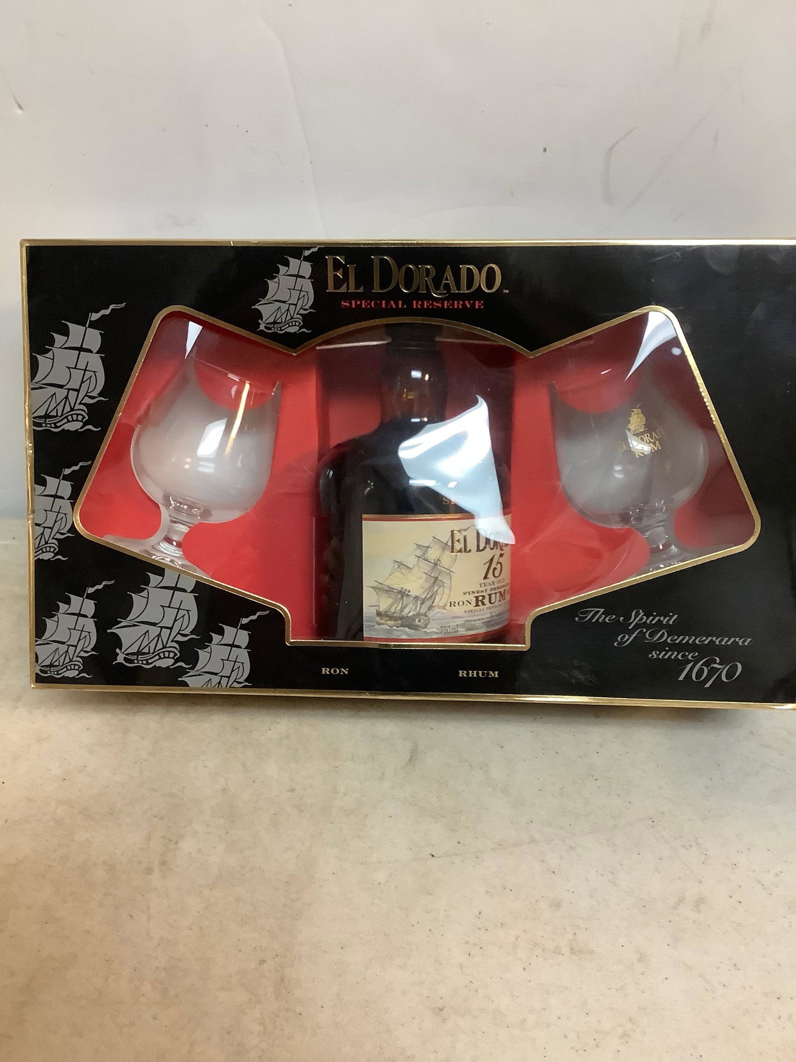 El Dorado Special Reserve Rum with 2 Glasses sealed: Any contents in bottle is Free; You are bidding on the bottle & unbroken tax stamp
