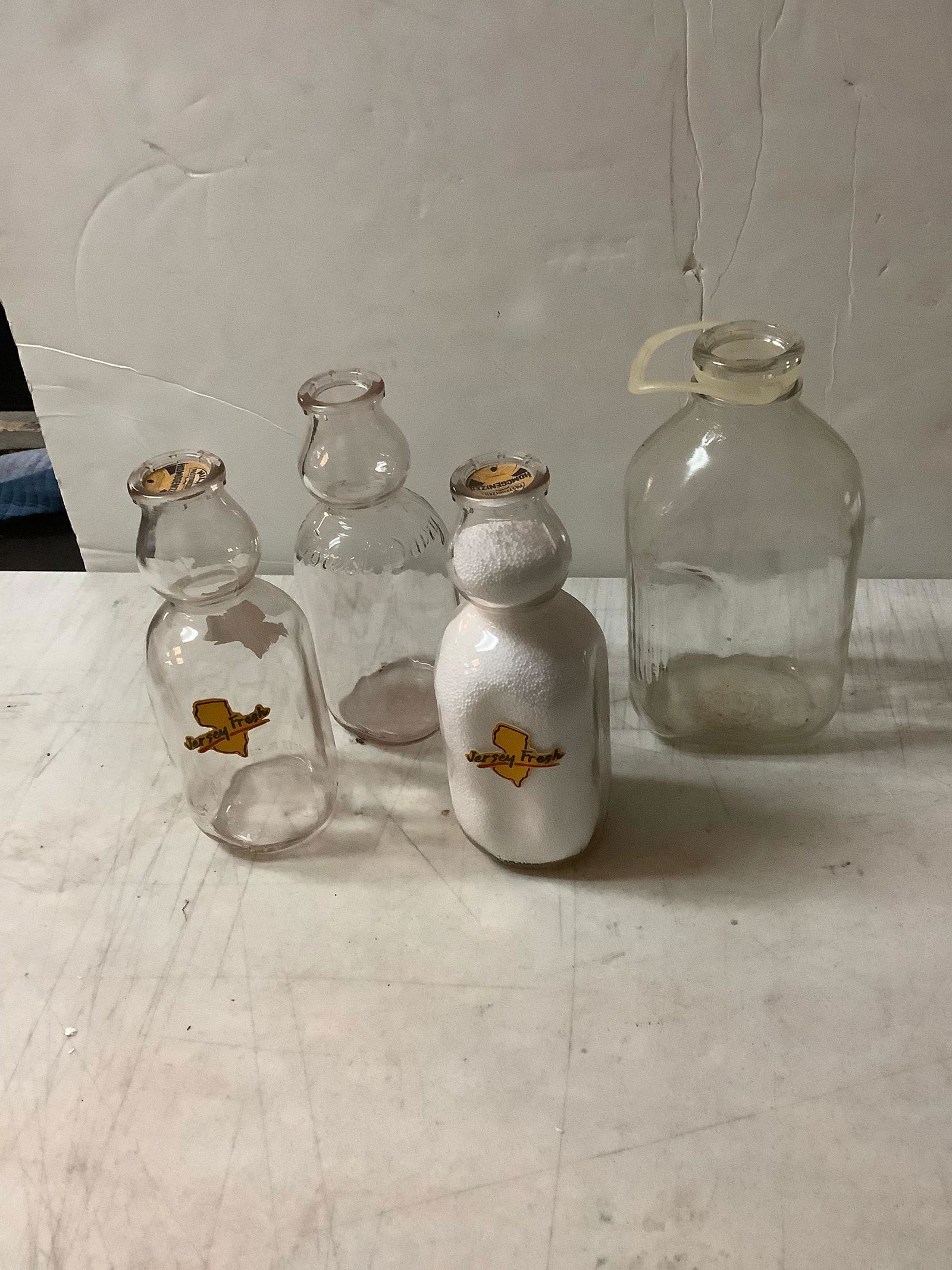 one 1/2 gallon, two 1 quart jersey fresh and one 1 quart forest daisy glass milk jugs (1 of 1)