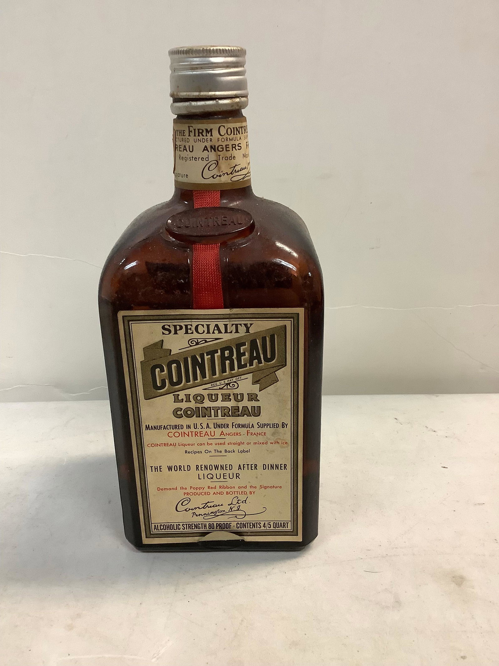 Cointreau specialty liquor: Any contents in bottle is Free; You are bidding on the bottle & unbroken tax stamp