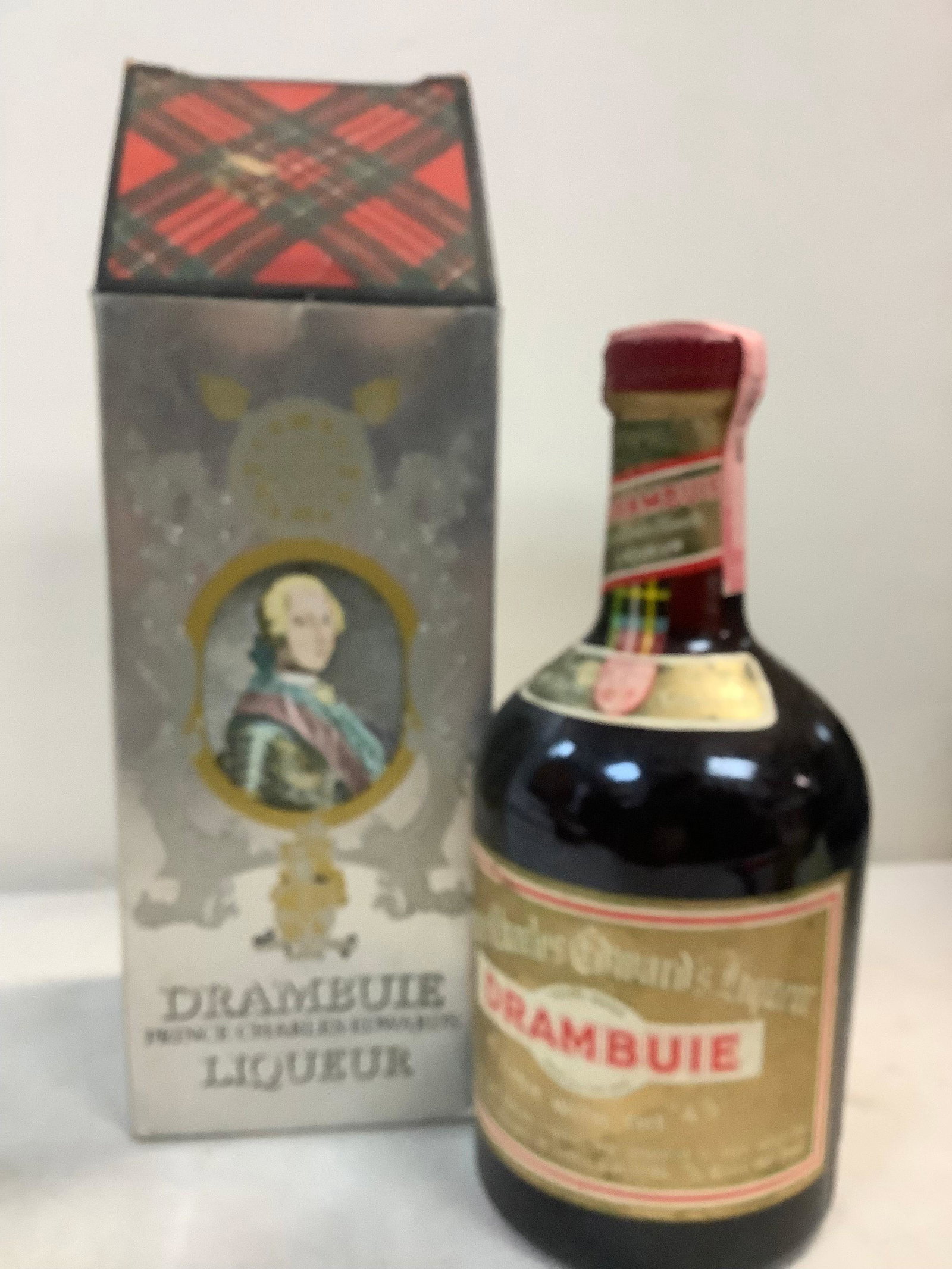 Drambuie pronce Charles liquor sealed: Any contents in bottle is Free; You are bidding on the bottle & unbroken tax stamp