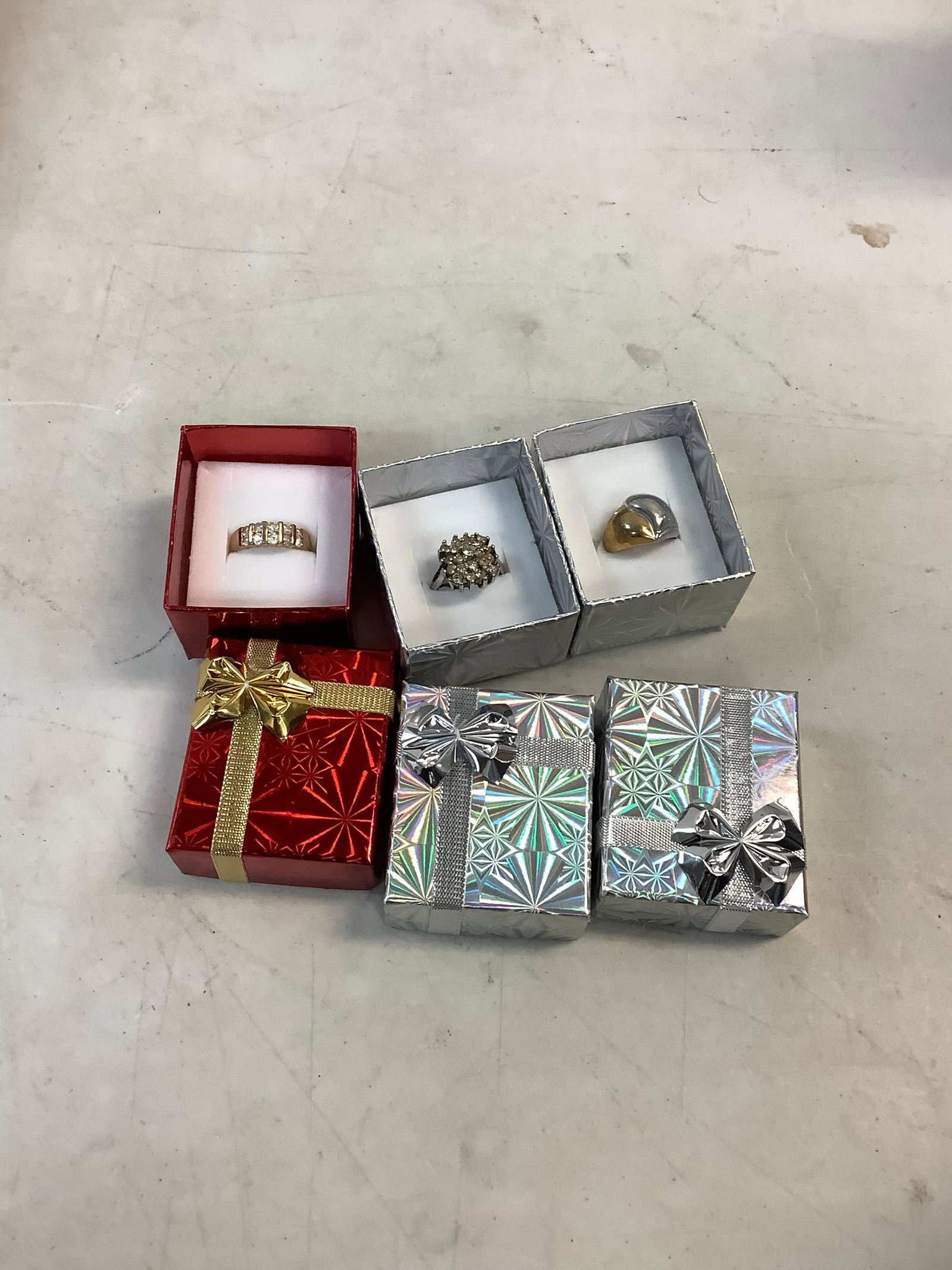 2 silver and 1 gold toned ring various sizes (1 of 1)