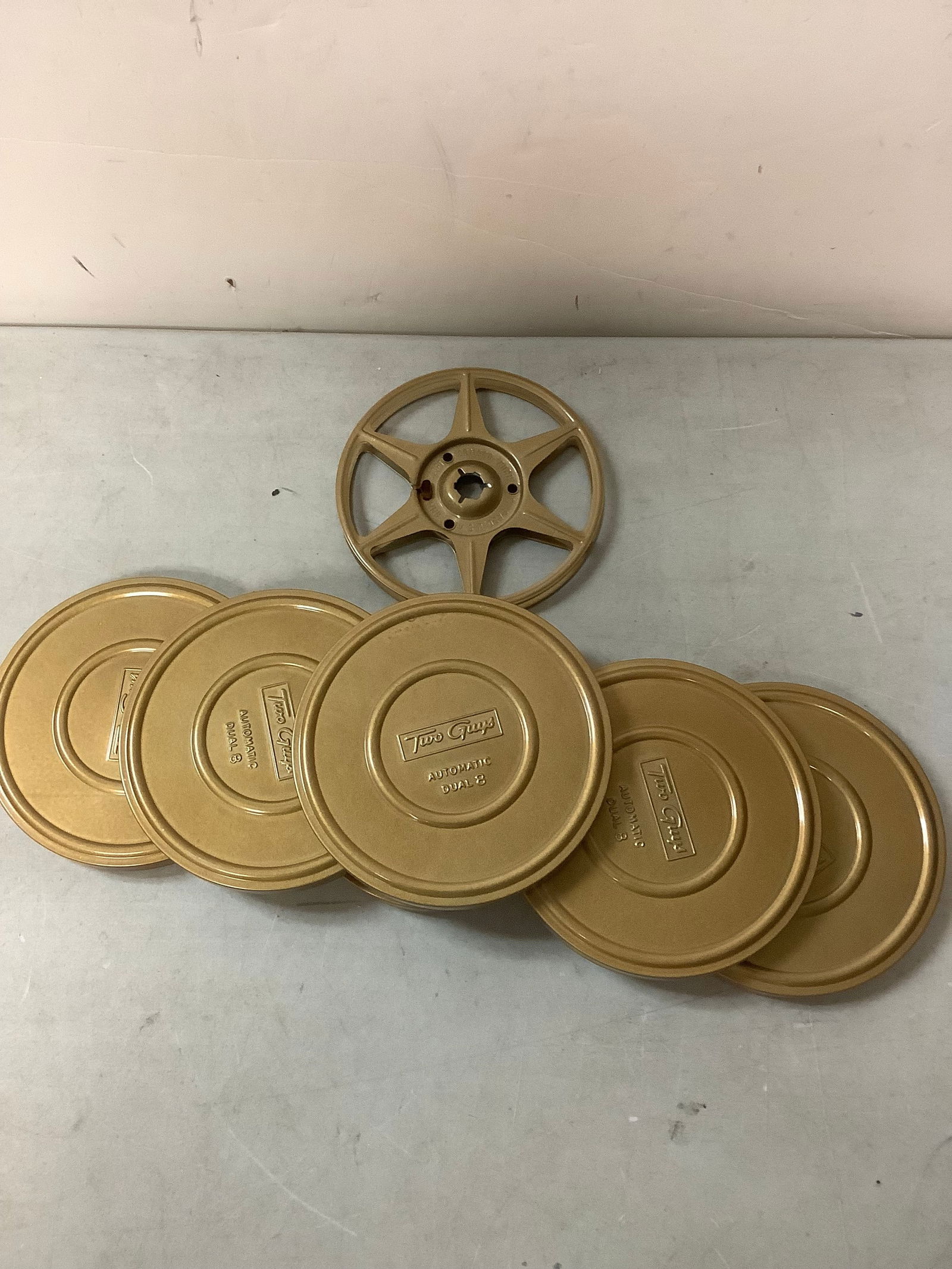 Two cups empty film reels and tins some with film (1 of 1)