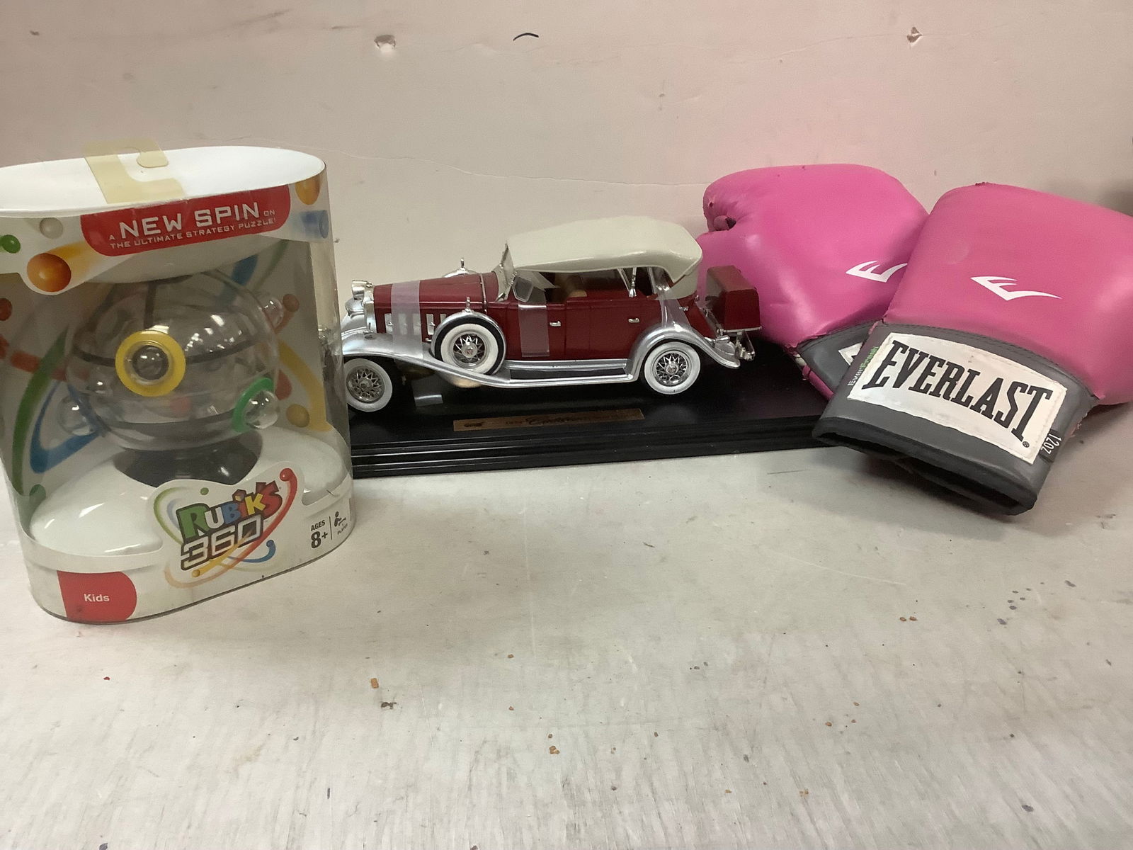 Lot of everlast boxing gloves, 1932 cadillac car model, and rubix puzzle ball (1 of 1)