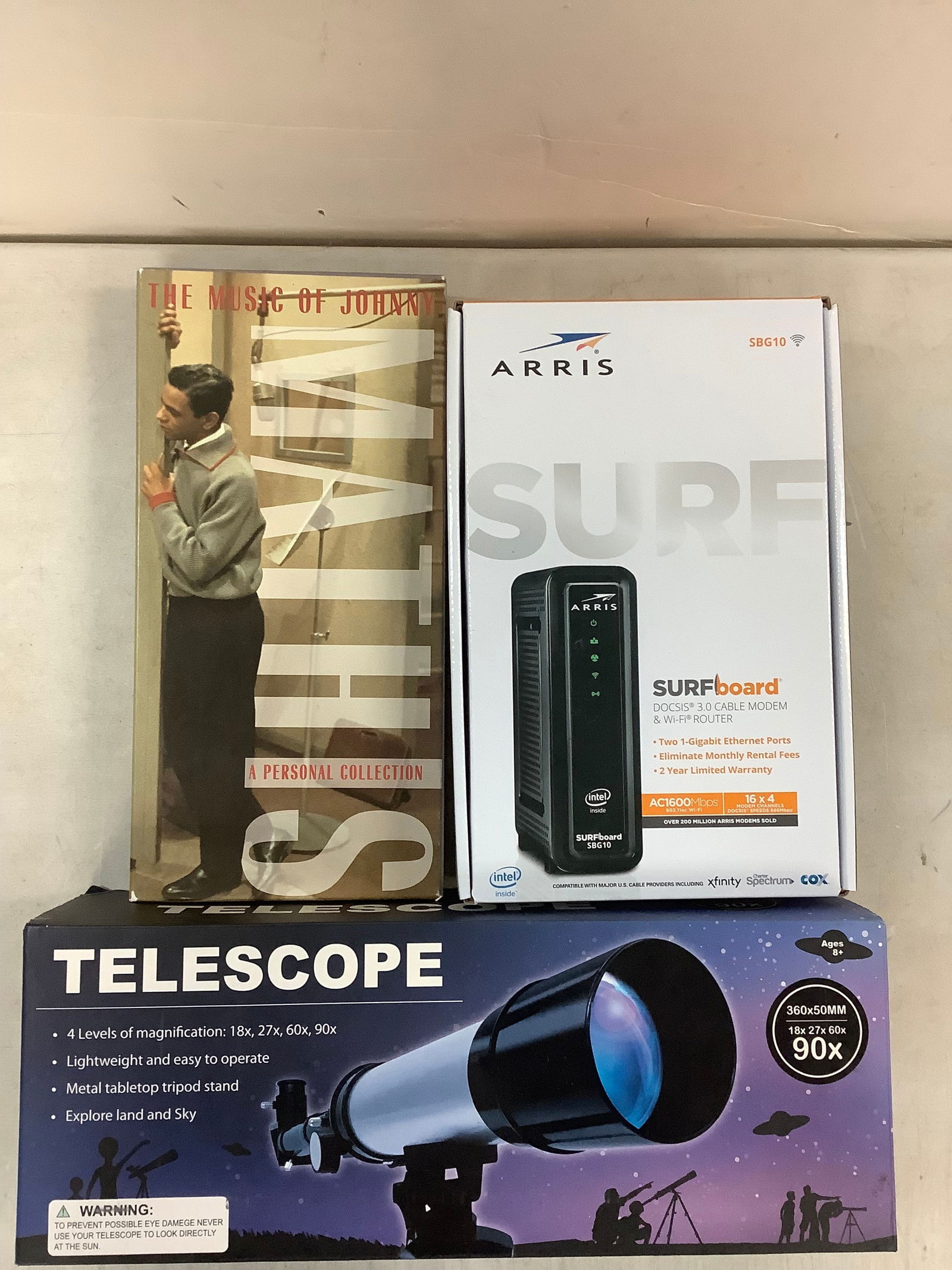 Arris surfboard cable modem & wi-fi router, telescope, and Johnny Mathis music collection (1 of 1)
