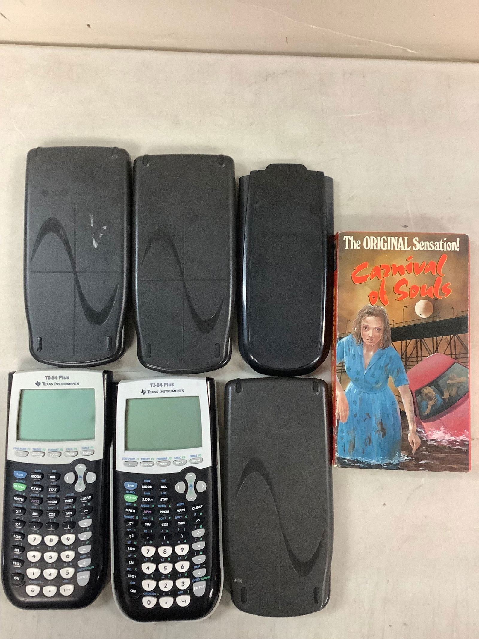 Lot of TI-84+ calculators, and carnival of souls VCR tape (1 of 1)