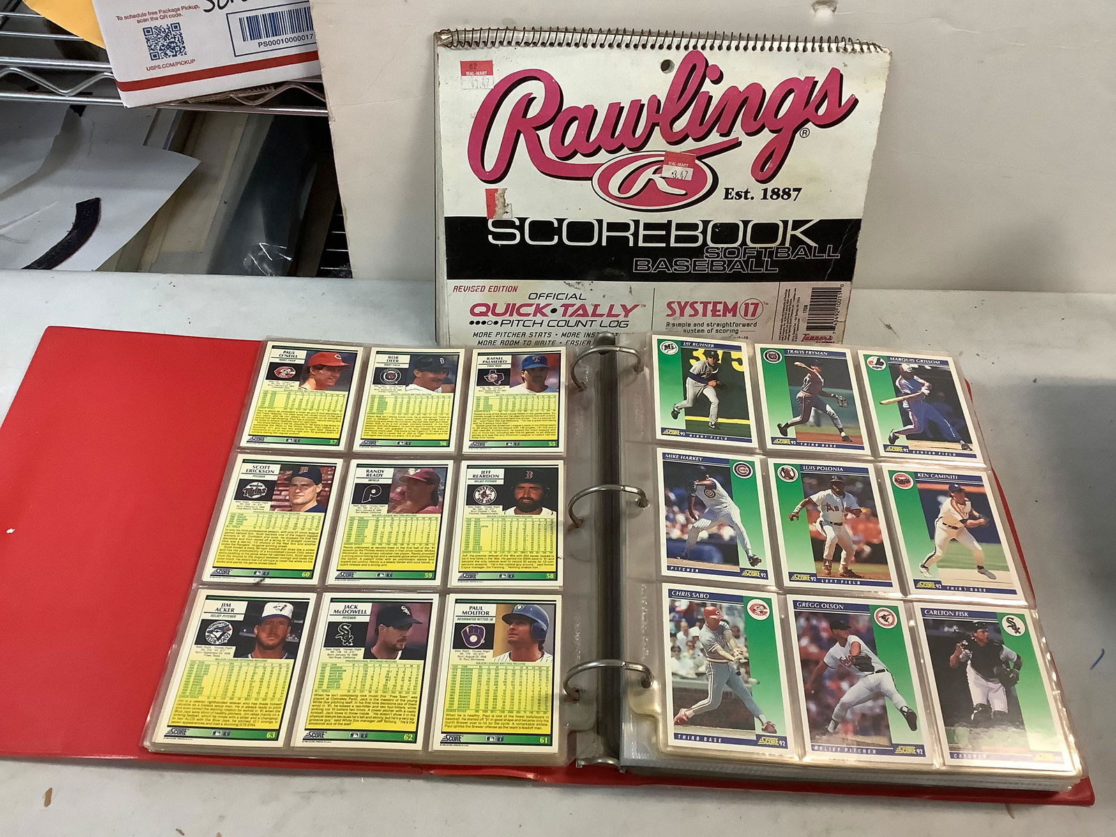 baseball cards collection binder filled with Rowling's softball/baseball score book (1 of 1)