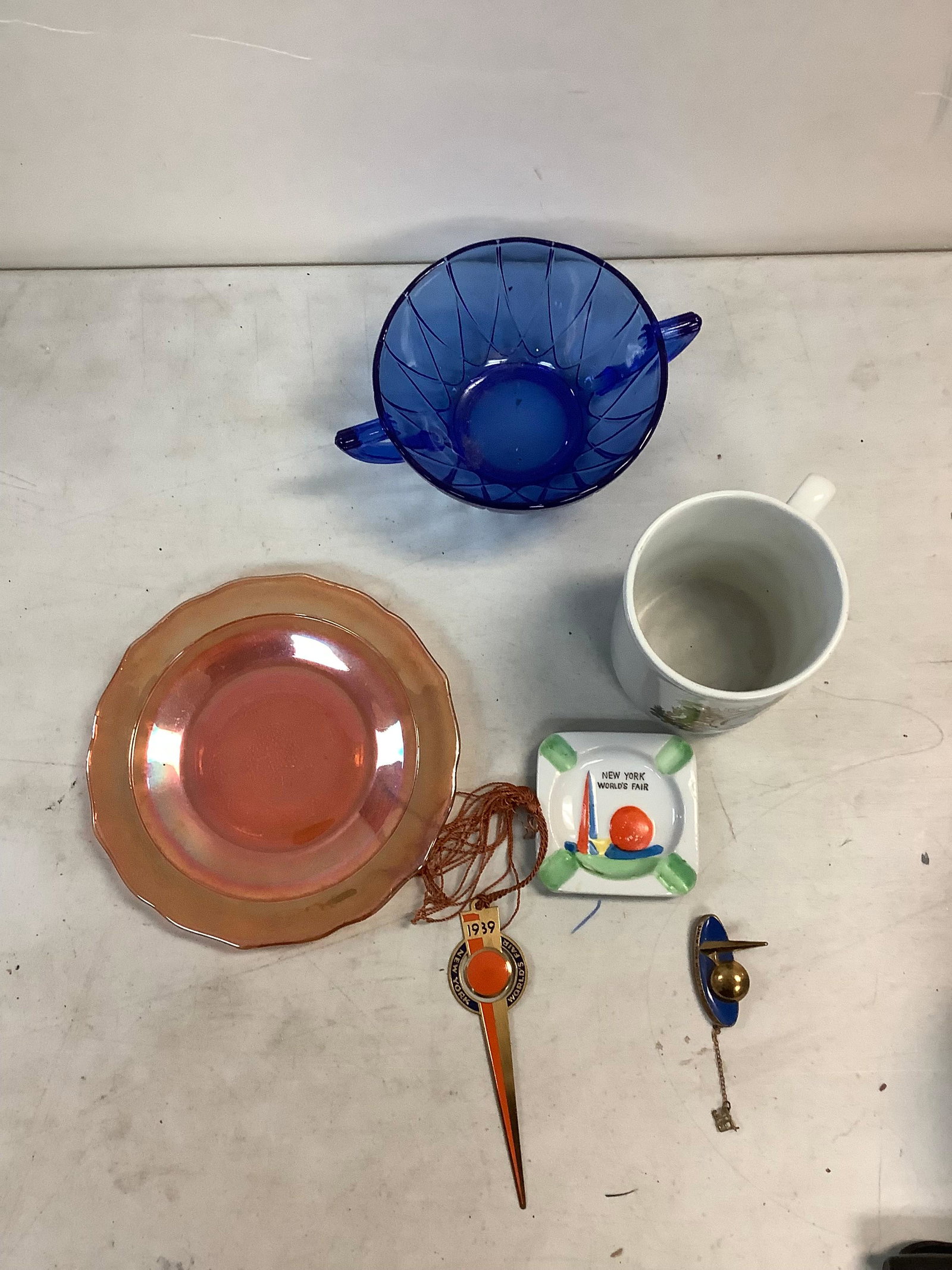 Lot of New York World's Fair Ashtray, Pin & Letter Opener, Queen Elizabeth Mug and Colored Glass: Lot of New York World's Fair Ashtray, Pin & Letter Opener, Queen Elizabeth Mug and Colored Glass Plate