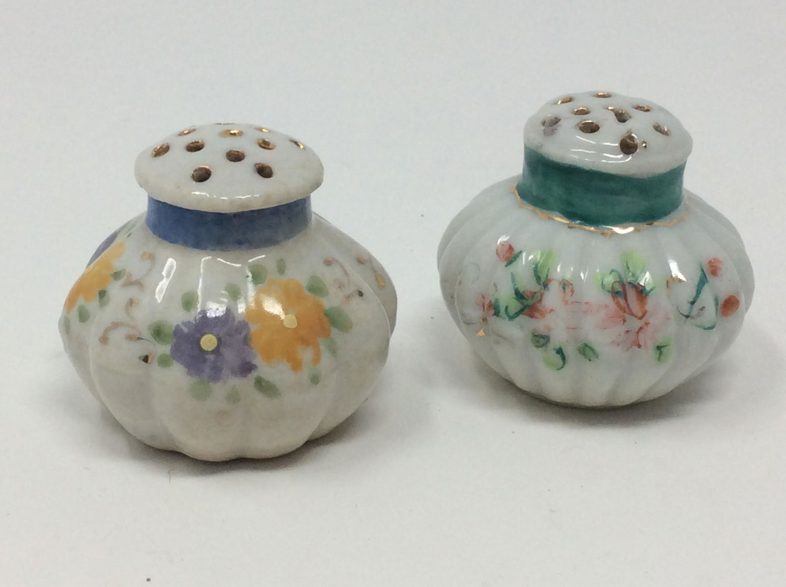 Vintage salt and pepper shakers with flower theme gold accents (1 of 1)
