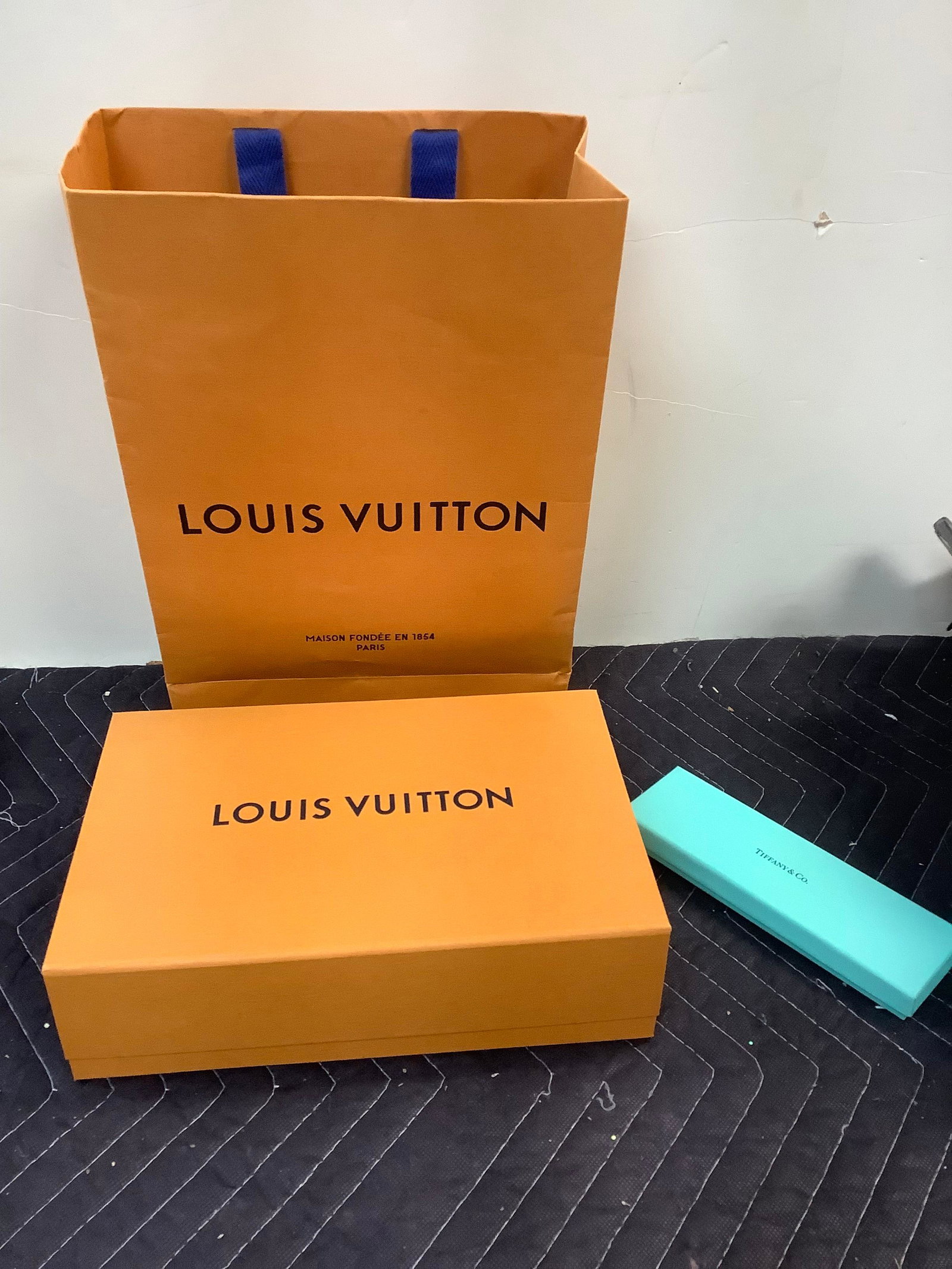 Empty louis Vuitton bag and box and a tiffany & Co. box: Empty louis Vuitton bag and box and a tiffany & Co. box