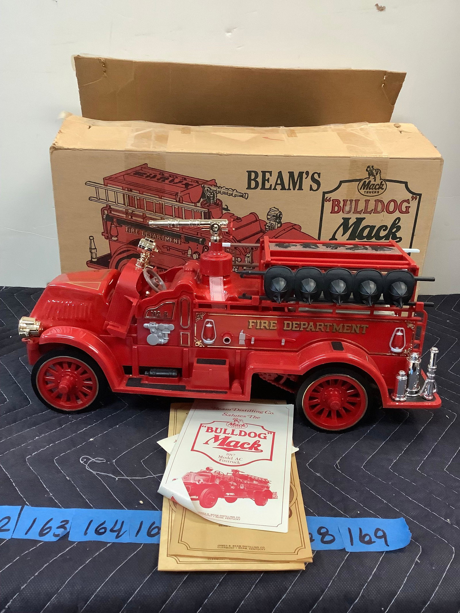 Mack trucks "Bulldog" Mack 1917 Model AC Firetruck Beam Decanter Sealed: Any contents in bottle is Free; You are bidding on the bottle & unbroken tax stamp