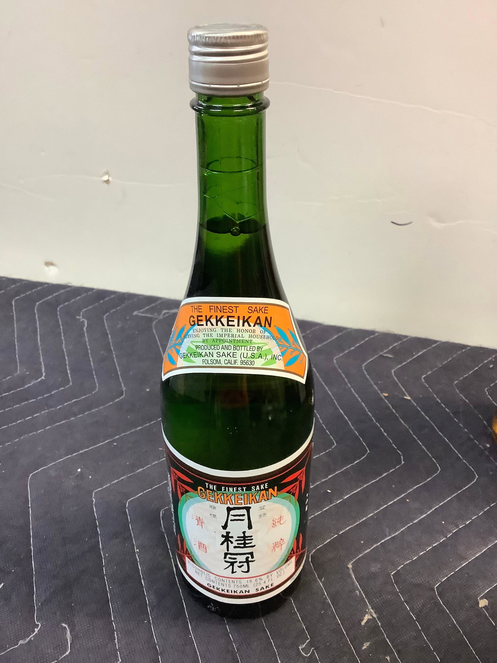 The Finest Sake Gekkeikan: Any contents in bottle is Free; You are bidding on the bottle & unbroken tax stamp