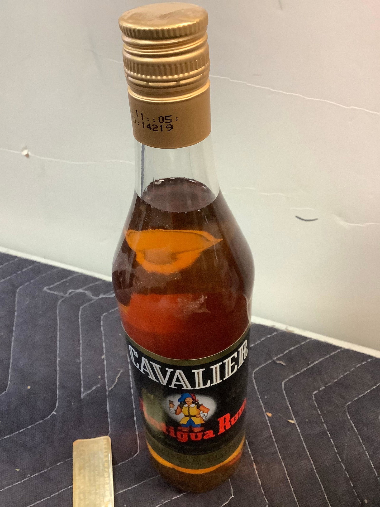 Cavalier Antigua Rum: Any contents in bottle is Free; You are bidding on the bottle & unbroken tax stamp