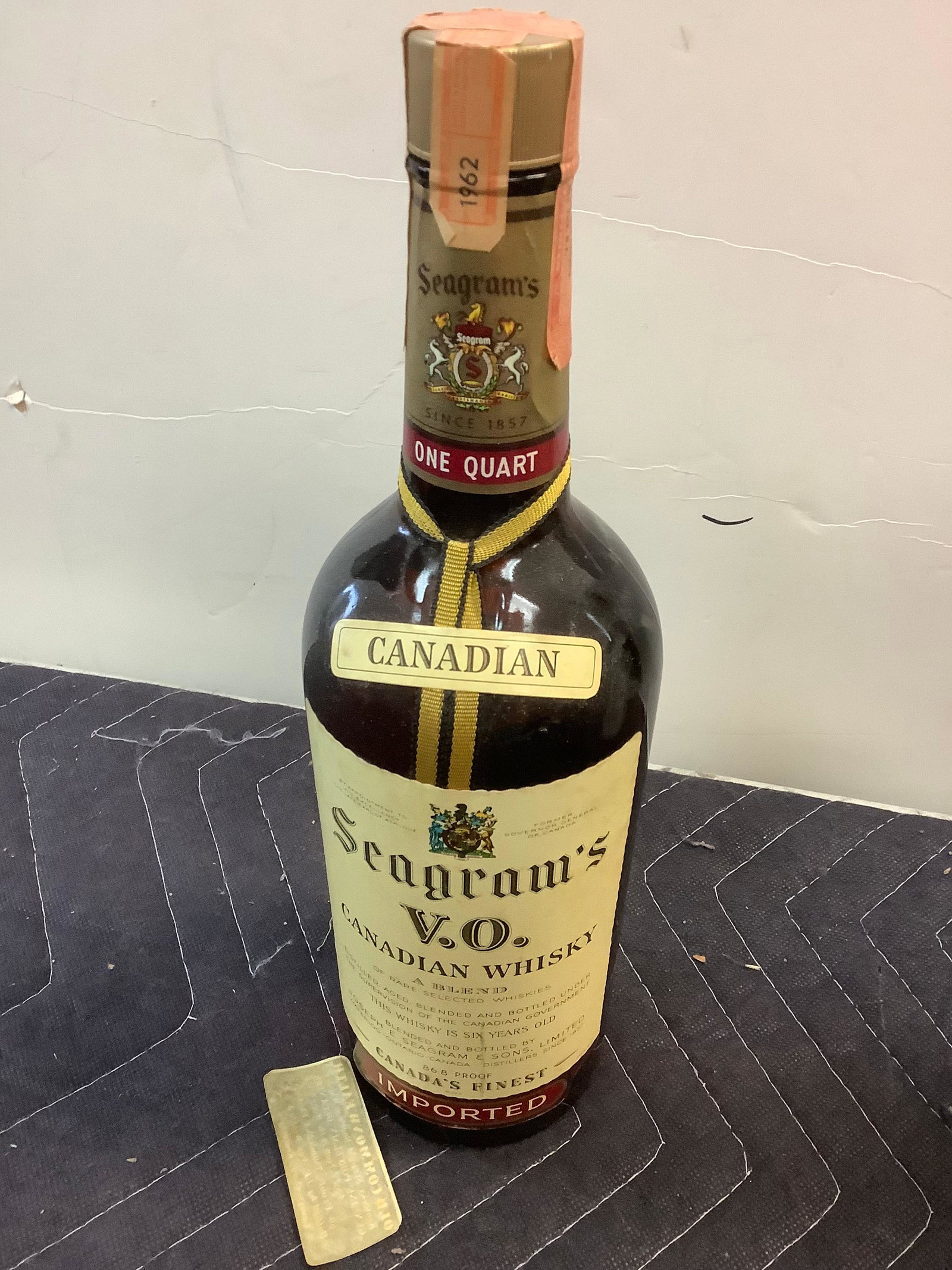 1962 Seagram's V.O. Canadian Whisky sealed: Any contents in bottle is Free; You are bidding on the bottle & unbroken tax stamp