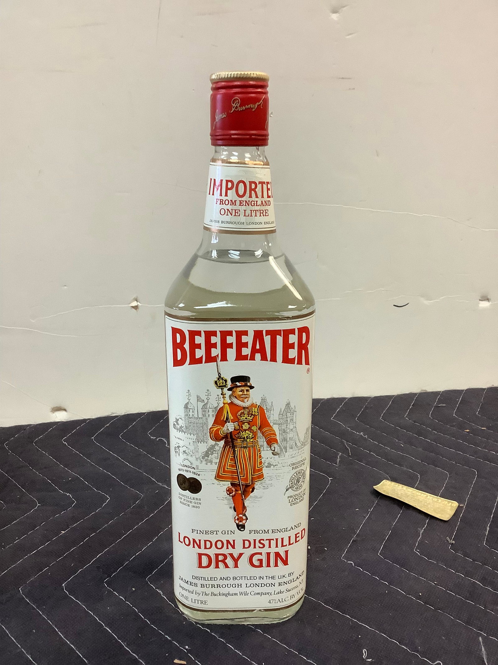 Beefeater London Distilled Dry Gin: Any contents in bottle is Free; You are bidding on the bottle & unbroken tax stamp
