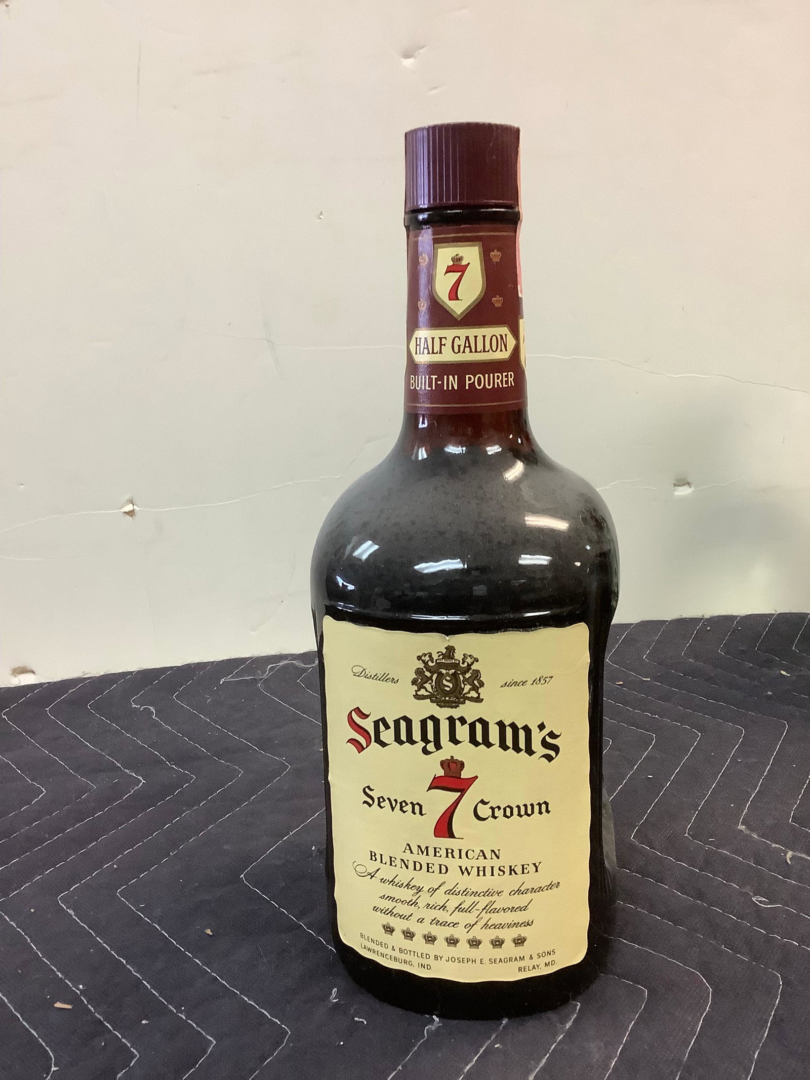 Seagram's Seven crown American Blended Whiskey: Any contents in bottle is Free; You are bidding on the bottle & unbroken tax stamp