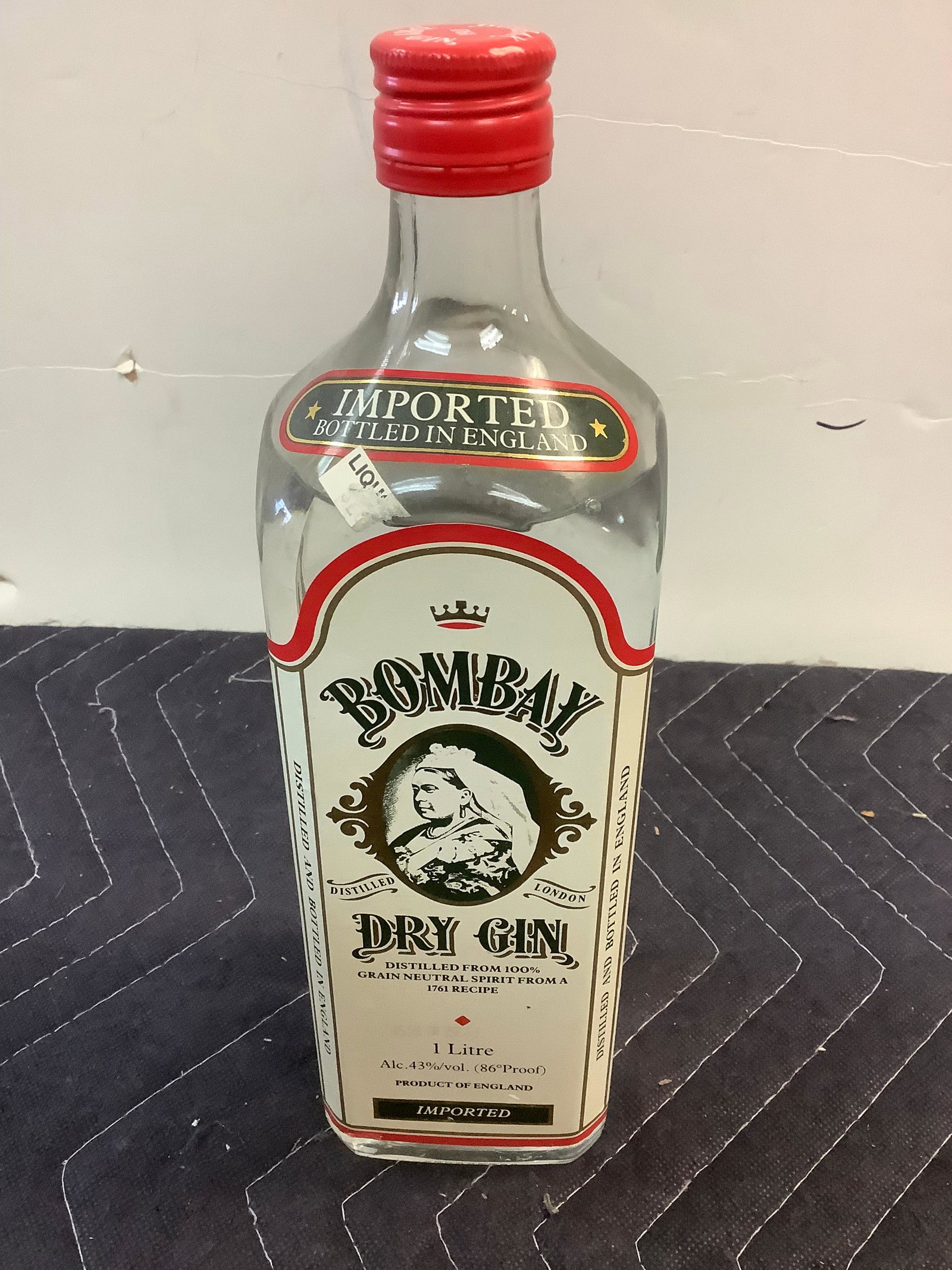 Bombay Distilled Dry Gin London: Any contents in bottle is Free; You are bidding on the bottle & unbroken tax stamp