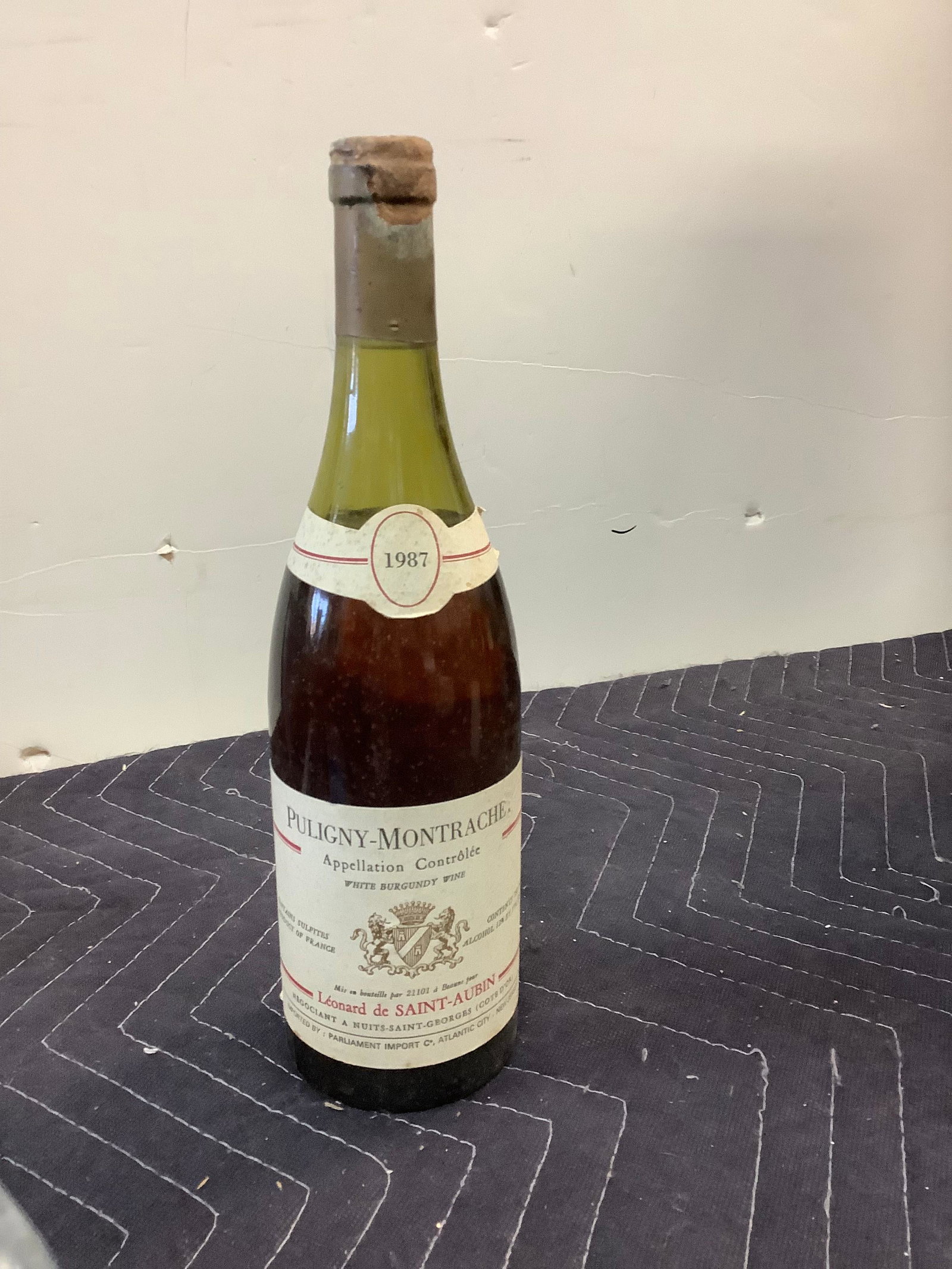 1987 Puligny-Montrachet White burgundy Wine: Any contents in bottle is Free; You are bidding on the bottle & unbroken tax stamp