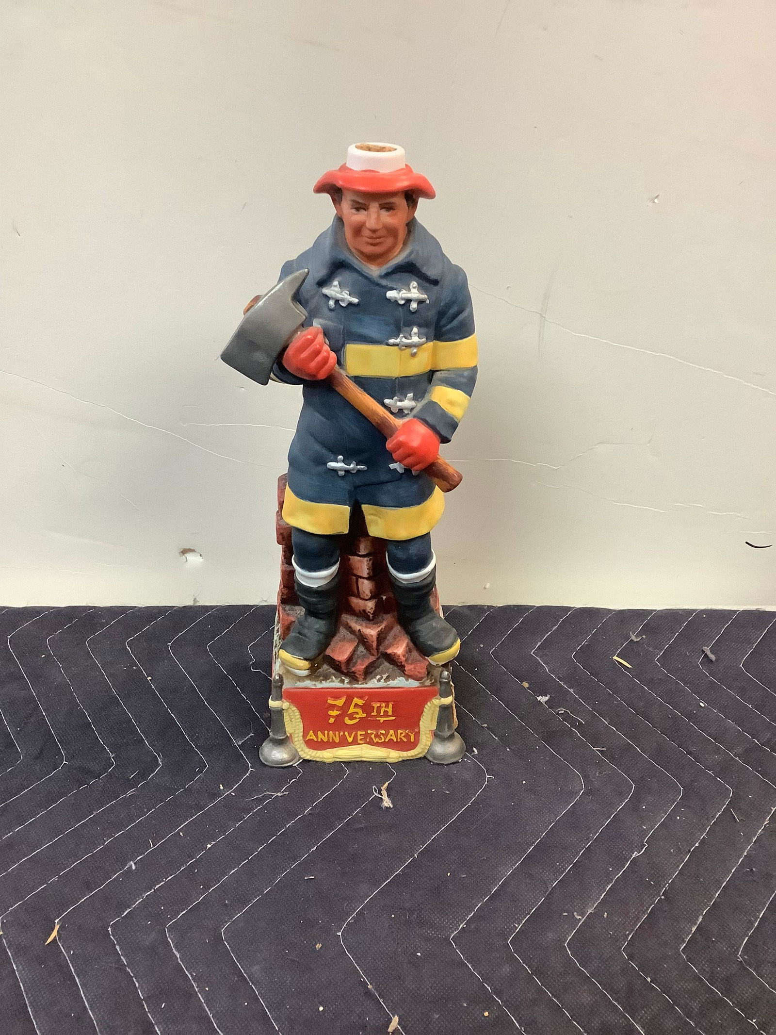 1976 Commonwealth Distillery Co, Collectors Limited Edition Hand Painted Porcelain Volunteer Fireman: 1976 Commonwealth Distillery Co, Collectors Limited Edition Hand Painted Porcelain Volunteer Fireman Decanter 13" (Half Filled) (MIssing Helmet)