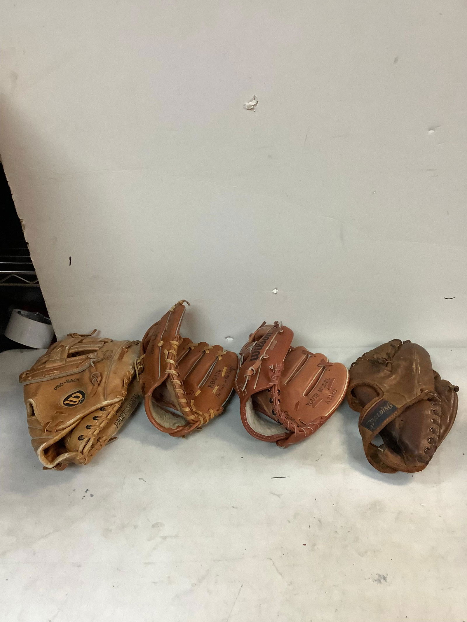 Wilson baseball glove, Spalding baseball glove, and more base ball gloves (1 of 1)