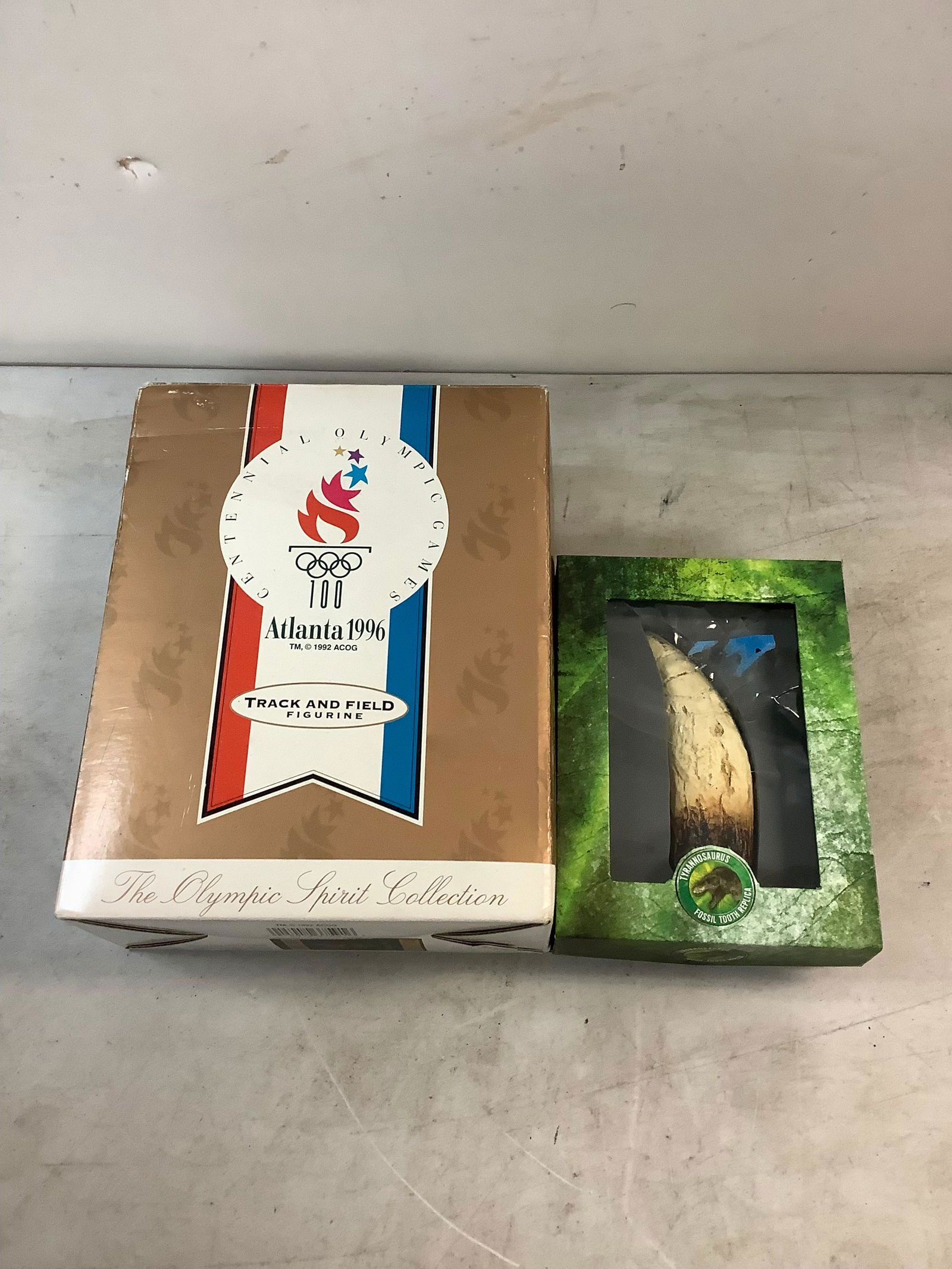 Lot of Atlanta 1996 track and field figurine and dinosaur fossil tooth replica: Lot of Atlanta 1996 track and field figurine and dinosaur fossil tooth replica