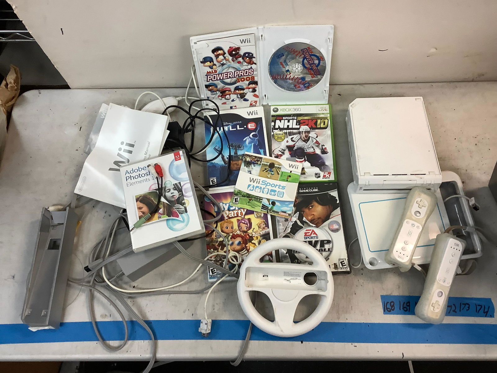 Wii system with nunchucks, 2 controllers, Wii steering wheel, drawing tablet, games, and more (1 of 1)