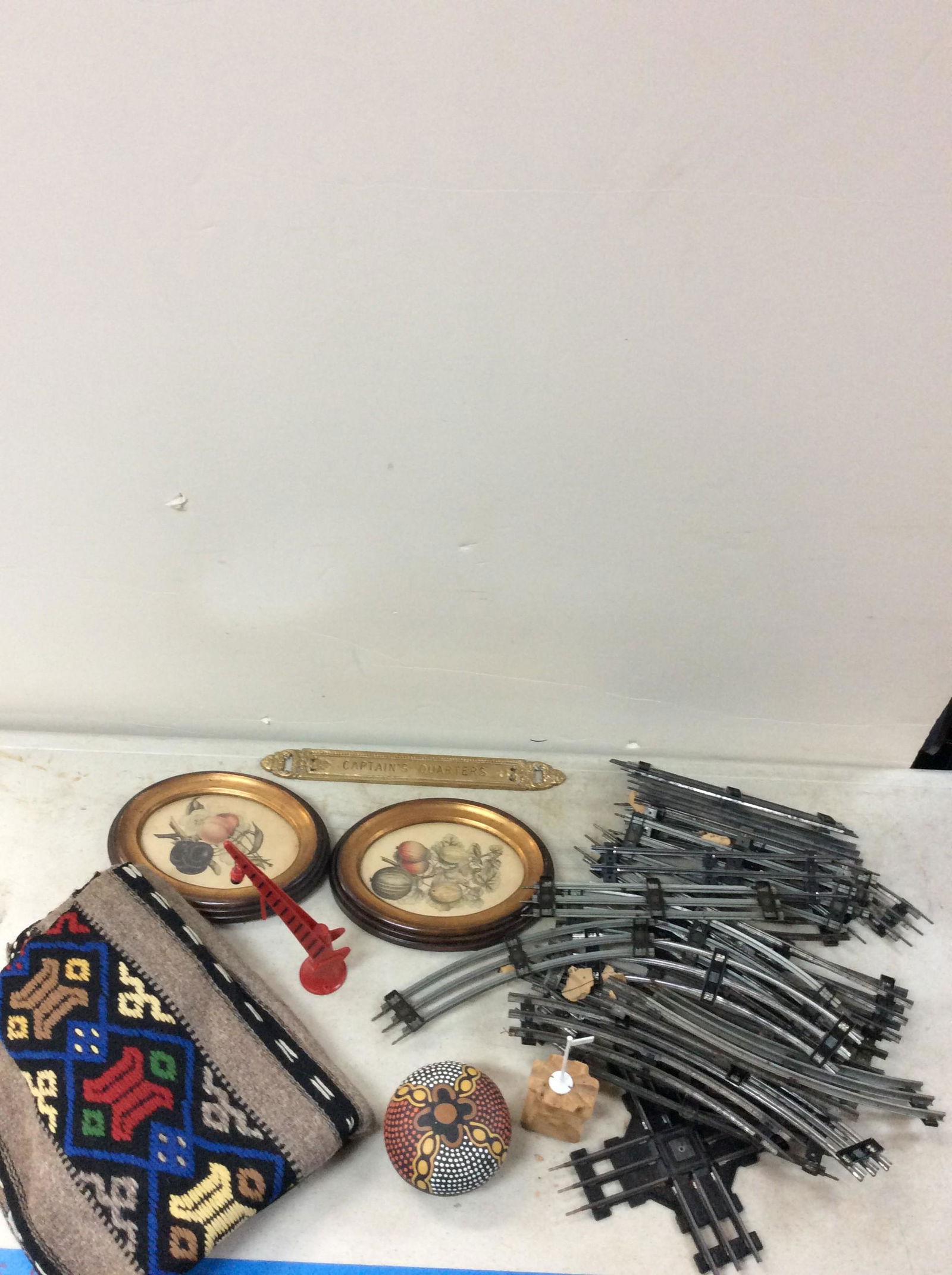 Lot of hand woven sweater, train tracks, framed fruit photos, and more. (tallest â€“ 12.5â€™â€™ x (1 of 1)