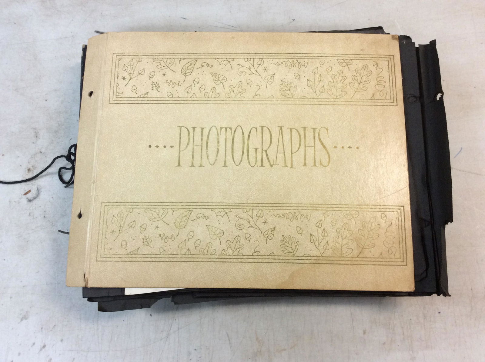 Old scrapbook with vintage black and white pictures (1 of 1)